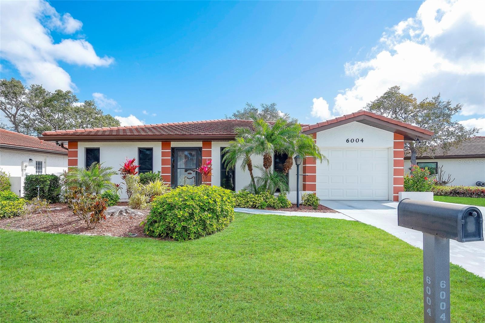 Just reduced $10,000.00! One of the largest floor plans in Vivienda I — and truly not to be missed!  Just minutes from IMG Accademy, and across from State College! This spacious, light, bright, 2 bedroom, 2 bath home offers comfortable, easy Florida living with a layout that feels open and inviting. The kitchen has been remodeled, with drawers, and a built- in pantry and flows seamlessly into the dining area and overlooks the family room, creating a perfect space for everyday living or entertaining.  The extra large lanai spans the entire length of the home, giving you abundant room to relax, dine, or enjoy the breeze. With no carpet anywhere, maintenance is a breeze for both full time and seasonal residents. Recent updates provide peace of mind: AC replaced in 2026, Hot water tank replaced in 2026.  Vivienda I is known for its friendly atmosphere, and the community pool serves as the social hub where neighbors gather and connect. The location is ideal—close to the beach for morning walks or sunset views, and just minutes from restaurants, banking, and everyday shopping. Quiet, convenient, and not age restricted, this affordable condo offers the best of Florida living.