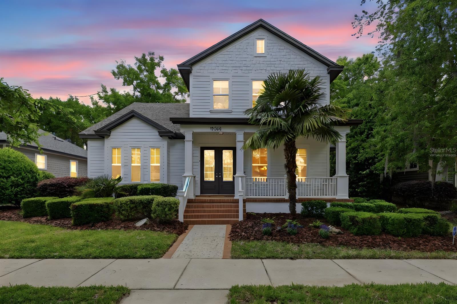 One or more photo(s) has been virtually staged. Located in the vibrant, golf-cart-friendly Town of Tioga, "Private backyard oasis with custom putting green." This beautifully designed home offers a perfect balance of timeless elegance and modern comfort. Featuring a flexible floor plan with 5 bedrooms and 4 full bathrooms, the home is thoughtfully designed to suit a variety of lifestyles. Upon entry, a welcoming foyer leads to a formal dining room, ideal for hosting gatherings and special occasions. The open-concept kitchen, complete with a casual dining area, flows seamlessly into the spacious family room, creating a warm and inviting space for everyday living and entertaining. A gas fireplace with a wood mantel adds charm and character to the main living area. Architectural details include extensive 5¼-inch crown molding and baseboards throughout, 10-foot ceilings on the first floor, and 9-foot ceilings on the second floor. The home also features a breezy front porch with brick pavers, a foyer with custom shelving, and a beamed ceiling in the family room. Another value added feature includes professionally installed exterior trim lighting that is remotely color controlled for seasons, special occasions, or sports team enthusiasm. The primary suite, privately situated at the front of the home, offers a true retreat with a large walk-in closet and a spa-like ensuite bath featuring dual vanities, a jetted tub, and a separate walk-in shower. The main level also includes an additional bedroom and full bathroom. Upstairs, two oversized bedrooms share a full bath, while a third upstairs bedroom includes its own private bathroom—perfect for guests or multi-generational living. Additional upgrades include quartz countertops, tile backsplash in the kitchen, rich wood flooring throughout the foyer, dining room, kitchen, and family room, tile flooring in all bathrooms as well as granite counters, and custom built-ins that enhance both style and functionality. Enjoy outdoor living year-round with a charming front porch and a spacious, fenced backyard complete with a private golf putting green. Recent updates include both AC units and the roof, replaced approximately three years ago, as well as a hot water heater replaced about two years ago. The Town of Tioga community offers resort-style amenities that are all just a short stroll away: golf-cart-friendly streets, paved trails, resort pool, children’s playground, park green spaces, tennis, volleyball, pickleball & basketball courts, and school bus stop all deliver a true five-star, lock-and-leave lifestyle. The Tioga Town Center is also just a short stroll away with its shopping, fine car shows, cultural events, Northwest Seafood, Dave’s New York Deli, Patticakes coffee & desserts, Tinker Latin Restaurant, Local Provisions Restaurant, Blue Highway Pizza, The West End Tavern, Fluid Lounge, Northwest Seafood, Volcanic Sushi, Cilantro Tacos and the world class ranked Gainesville Health & Fitness Center. More than a home, this is a rare fusion lifestyle of exceptional quality, timeless character, and irresistible charm.