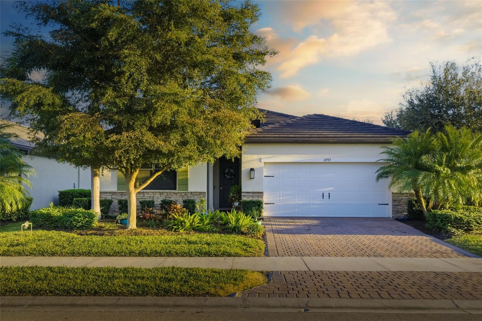 Skio the wait- Wellen Park home with upgrades and views in a gated community. Step into the ultimate Florida lifestyle with this four bedroom, two bathroom home featuring an open floor plan perfectly positioned in the highly sought after Wellen Park community, one of the most talked about communities in Florida. The spacious layout flows effortlessly into a stunning kitchen with a beautiful island, creating the perfect place for gatherings, laughter, and meaningful conversations. Enjoy a private backyard with no homes behind you and a serene park like setting where you can relax on the covered lanai, listen to birds chirping, and enjoy peaceful mornings and tranquil evenings you will never want to leave. This home also features a **one year new AC**, a newer Samsung refrigerator, and maintenance free landscaping for true lock and leave convenience. The gated community offers extra peace of mind and an incredible lifestyle with a clubhouse just across the street, complete with a fitness center, bocce ball, pickleball courts, resort style pools, scenic walking paths, and inviting spaces to sit, unwind, and enjoy nature. Check out how close you are to shopping, dining, and the beautiful Gulf beaches, making this an exceptional place to call home in Florida. Some photos have been virtually staged to give you inspiration! Schedule your showing today!