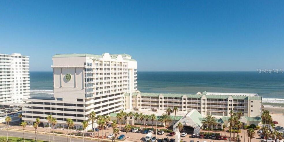 Turnkey investment opportunity in the highly desirable Daytona Beach Resort & Conference Center! This 4th-floor, west-facing condo offers beautiful sunset views and an ideal setup for both personal use and income-producing short-term rentals. Located just steps from the sand with direct beach access, this resort-style property is also within walking distance to shops, restaurants, and entertainment, making it highly attractive for vacationers year-round. Whether you choose to self-manage or take advantage of the full onsite rental management program, the flexibility here makes ownership effortless. Enjoy top-tier amenities including multiple pools, a children's splash pool, indoor pool, indoor spa, sauna, fitness center, and on-site laundry facilities--everything guests look for in a beachside stay. Inside the unit, a full kitchenette provides added convenience for extended stays and increased rental appeal.

Perfect as a vacation getaway, income-producing Airbnb/short-term rental, or beachside investment property, this condo offers unbeatable location, amenities, and rental potential in the heart of Daytona Beach.

Don't miss your chance to own a slice of the beach with built-in income possibilities!