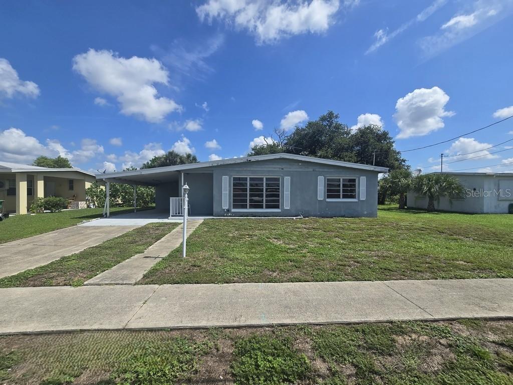 Virtually Staged. Located in central Port Charlotte, Great bones and a lot of potential. This home offers a 2 bedroom 1 bath floor plan with a open Covered enclosed Lanai for extra space. This is a great opportunity for the investor, or snowbird looking to make a good investment. Call and request your appointment today/