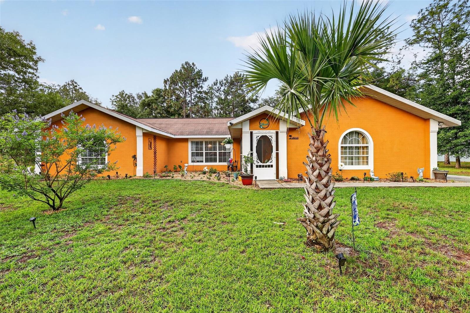Country living with the convenience of being close to Dunnellon and easy access to Ocala!  This spacious 1.11-acre property features fruit trees, a deer feeder, chicken coop, and plenty of room to grow whatever you desire. Most of the yard is irrigated for easy maintenance.

Step through the screened covered porch into a bright and open home with cathedral ceilings and a comfortable open floor plan. The kitchen boasts new appliances (installed in 2020), granite countertops, a stylish backsplash, a pantry, and a garbage disposal. Vinyl plank flooring throughout makes for easy care and a modern look. The master bedroom has an ensuite bath with tiled shower and large walk in closet, the vanity was updated in 2020.  The guest bath has a shower and tub combination with newer vanity as well. The split bedroom plan allows for privacy for the master suite. The covered lanai is a great place to sit an enjoy nature like deer and turkeys that roam the property.

The home offers four bedrooms plus a versatile flex room currently used as a homeschool space. Inside laundry includes extra storage, and the washer and dryer are included. The well is equipped with a filtration system, the bladder was replaced in 2026, and the septic was pumped in 2026. New Air conditioner in 2024. There is an 18 X 28 detached steel garage with electric and and additional storage building that is 8 X 8. The backyard is fenced with chain link and has a double gate for easy equipment entry.  The seller is offering a credit at closing for roof ( if not replaced by closing)

For your enjoyment, the swing set and gazebo are included, as well as workout equipment in the garage. If you prefer, the seller will remove these items. ALL of this and included in the HOA is private access to Rainbow River, for homeowners and clubhouse.  The clubhouse offers  swimming pool, pickle ball  and tennis courts. Experience the best of country living with all the conveniences you need!