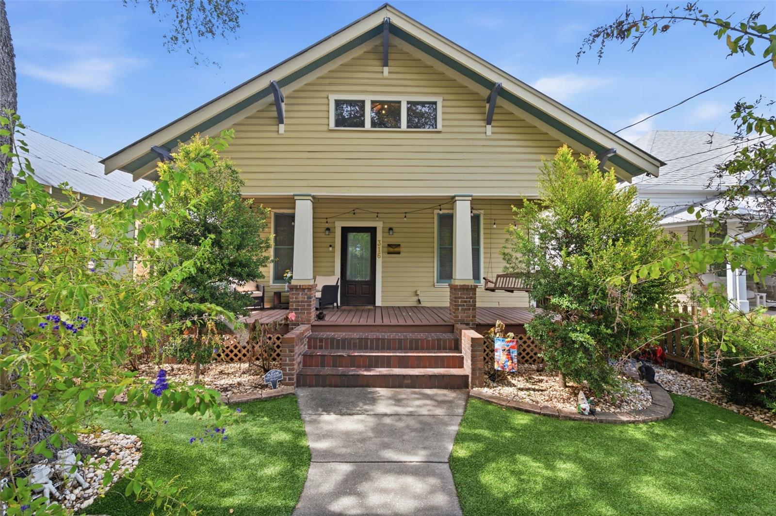 Exceptional opportunity to own a character-filled bungalow in the heart of Tampa Heights, where historic charm meets comfort. This home offers 2 bedrooms and 2 bathrooms, with a spiral staircase leading to a flexible upper-level retreat ideal as a 3rd bedroom, private office, art studio, or dedicated getaway for children and teens. The home has beautiful arched doorways with impressive ceiling heights, hardwood flooring, a welcoming fireplace, and updated kitchen —ideal for both daily living and hosting guests.  The outdoor space is designed for enjoyment and ease, featuring artificial turf, drip irrigation, and a comfortably sized backyard with a deck off the house, pergola sitting area with multiple areas to relax and unwind. Alley access leads to a dedicated rear parking pad, a highly coveted amenity in this sought-after neighborhood.  For buyers looking to create a family compound or enjoy close proximity to loved ones, the neighboring property at 314 E. Frances Avenue is also available for purchase.  Located just moments from Downtown Tampa, the Riverwalk, acclaimed dining, entertainment, and local hotspots, this distinctive property offers the perfect balance of neighborhood charm and urban convenience.