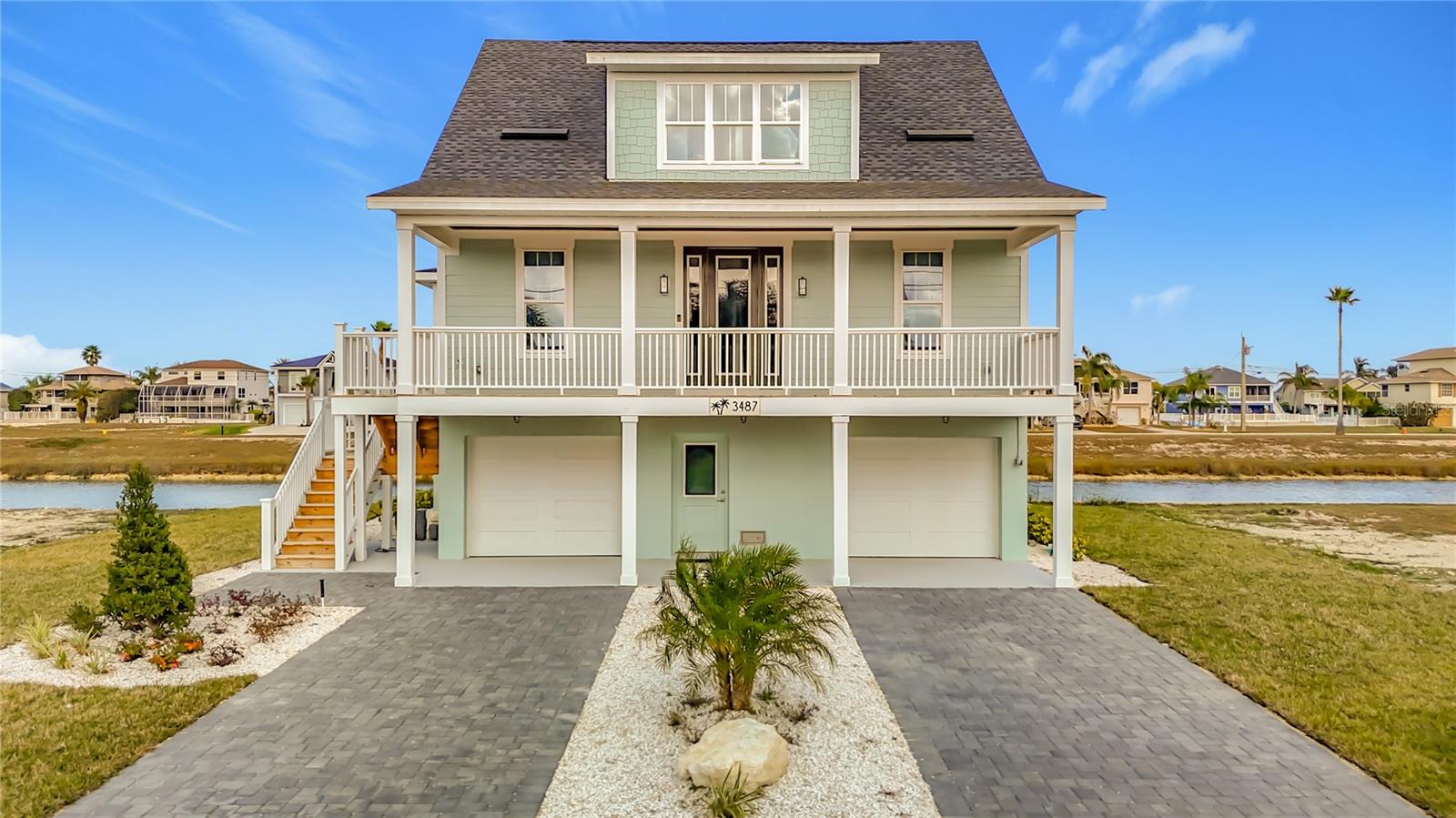 Exceptional waterfront new construction offering Gulf views from the third-floor balcony. This home reflects detailed craftsmanship, refined finishes, and thoughtful architectural detail throughout. Expansive covered front and rear porches span the full width of the home, creating elegant indoor and outdoor living spaces ideal for both entertaining and quiet relaxation. Enjoy direct water access with the ability to launch a kayak or paddleboard from your backyard, embracing a true coastal lifestyle. Gulf access via boat lift. Designed to maximize natural light and water views, this custom-quality residence presents a rare opportunity to own a distinctive waterfront home in a premier setting. Enjoy great fishing, scalloping, or hanging out at the flats.