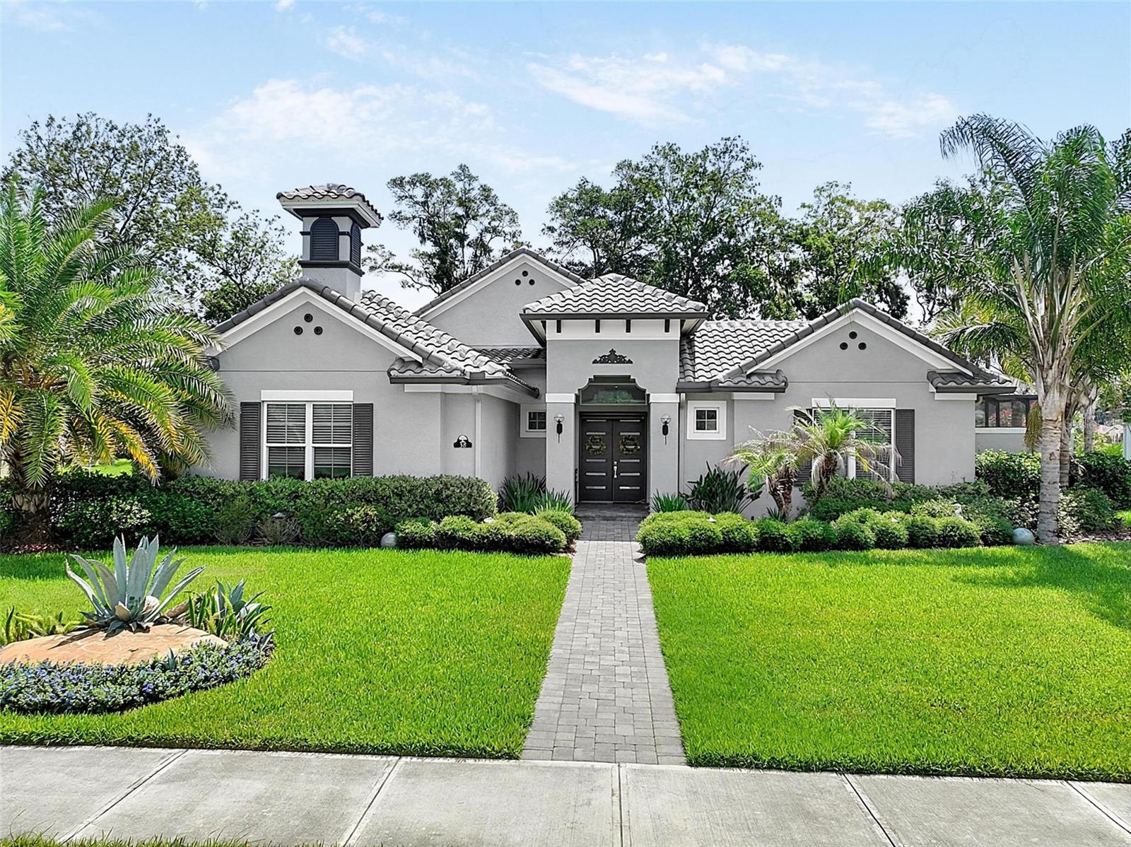 Virtually Staged. Some homes simply feel different, and this is one of them. Located in the exclusive gated community of Toscana, this beautifully upgraded 2021 courtyard home combines luxury finishes, thoughtful design, and an incredible indoor-outdoor lifestyle on an oversized 15,000+ square-foot homesite with exceptional privacy. With no homes directly across the street and carefully selected upgrades throughout, this residence offers the perfect balance of elegance, comfort, and everyday livability.

Designed for true Florida living, the centerpiece of the home is the spectacular private courtyard featuring a heated pool that creates your own personal outdoor oasis. Expansive sliding glass doors from the main living areas, owner's suite, and detached casita seamlessly blend indoor and outdoor living, making this home perfect for entertaining, relaxing, or simply enjoying your own private retreat.

The open-concept floor plan is filled with natural light and showcases soaring ceilings, custom finishes, and quality craftsmanship throughout. The gourmet kitchen is as beautiful as it is functional, offering premium appliances, abundant cabinetry, expansive counter space, and a large center island overlooking the spacious living and dining areas. Whether you're hosting friends or enjoying a quiet evening at home, this space was designed to bring people together.

The owner's suite is a true sanctuary with direct access to the courtyard, creating a peaceful escape just steps from the pool. The spa-inspired bath, generous walk-in closet, and thoughtfully designed finishes complete the retreat. The detached casita offers exceptional flexibility with its own private bath, making it ideal for overnight guests, multigenerational living, a home office, fitness room, media room, or hobby space.

Every detail throughout the home reflects pride of ownership, from the designer lighting and premium finishes to the spacious laundry room and oversized three-car garage with room for vehicles, golf carts, storage, and all of your Florida lifestyle essentials.

What truly sets this home apart are the countless upgrades that have already been completed. Why wait months for new construction and spend thousands more on upgrades when this home offers a level of quality and attention to detail that's difficult to duplicate? Every improvement has been thoughtfully selected to enhance both everyday living and long-term value.

If you've been searching for a home that offers luxury without sacrificing comfort, privacy without feeling isolated, and a design that embraces the Florida lifestyle, this is the one. Beautifully maintained, thoughtfully upgraded, and move-in ready, this exceptional Toscana residence is ready to welcome its next owners home.