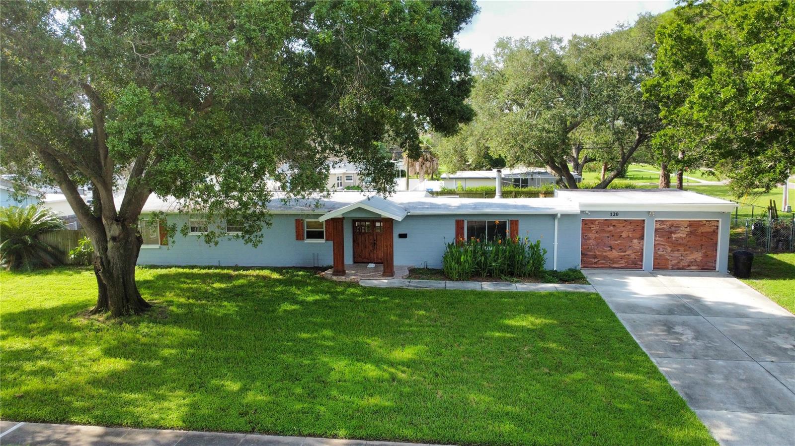 Welcome to Rio Vista, one of St. Petersburg's most sought-after neighborhoods. This charming community offers a prime location near Weedon Island and Riviera Bay, perfect for outdoor enthusiasts who enjoy fishing, canoeing, and other recreational activities. With close proximity to dining, shopping, beaches, major roadways, and Downtown St. Petersburg's vibrant attractions, this home is ideal for those seeking both convenience and a serene lifestyle. Situated on a spacious corner lot, this property offers an ample backyard perfect for family gatherings and outdoor enjoyment. Dive into the inviting saltwater pool, featuring a new cell and computer system, an 8.5-foot depth, 16 x 33' long and stunning pebble-tech and shell interior finish. As you step inside, you'll be greeted by beautiful double doors leading into a thoughtfully designed interior. The family room, complete with a cozy fireplace, provides a perfect space for relaxing on cooler nights. The kitchen offers ample countertop space and a clear view of the dining area and backyard, making it perfect for both cooking and entertaining. The master bedroom is a nice retreat featuring double doors that open to the pool area, a remote-controlled ceiling fan, a cedar walk-in closet, and a remodeled En-suite bathroom with a teak wood sink. A second guest bathroom has also been updated with modern finishes. Additional highlights include fresh interior and exterior paint, a roof replaced five years ago with durable modified bitumen, a two-car garage, and large Quonset hut shed in the backyard. This home is move in ready yet offers endless possibilities for personal touches. Don't miss this fantastic opportunity to own a piece of Rio Vista's charm!
