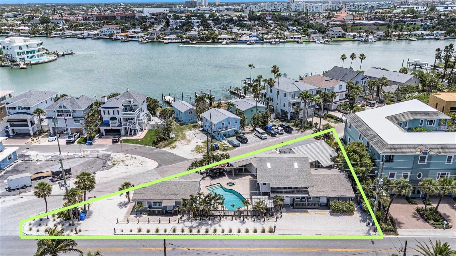 STEPS TO THE BEACH | 4-UNIT COMPOUND | GULF + INTRACOASTAL LOCATION | POOL | 12 PARKING SPACES | NO HOA | SUNSET BEACH

Welcome to “The Point” — a rare multi-unit beach compound in Sunset Beach on Treasure Island, located just steps from the Gulf of Mexico and positioned between the Gulf and Intracoastal Waterway on a unique triangular lot.

This turnkey coastal property features four private residences, including:

One 3-bedroom, 2-bath unit
Three 2-bedroom, 1-bath units

Each unit offers open floor plans, full kitchens, private entrances, and updated finishes including quartz countertops, shaker cabinetry, luxury waterproof vinyl flooring, brushed nickel fixtures, and impact-rated windows.

The two-story unit features vaulted ceilings and partial Gulf views, enhancing the overall appeal for both personal use and rental potential.

At the center of the property is a private resort-style pool, surrounded by tropical landscaping and shell accents, creating a true coastal retreat atmosphere ideal for both owners and guests.

RS-15 zoning provides exceptional flexibility—ideal for a family compound, income-producing investment, seasonal retreat, or hybrid use (buyer to verify with the City of Treasure Island).