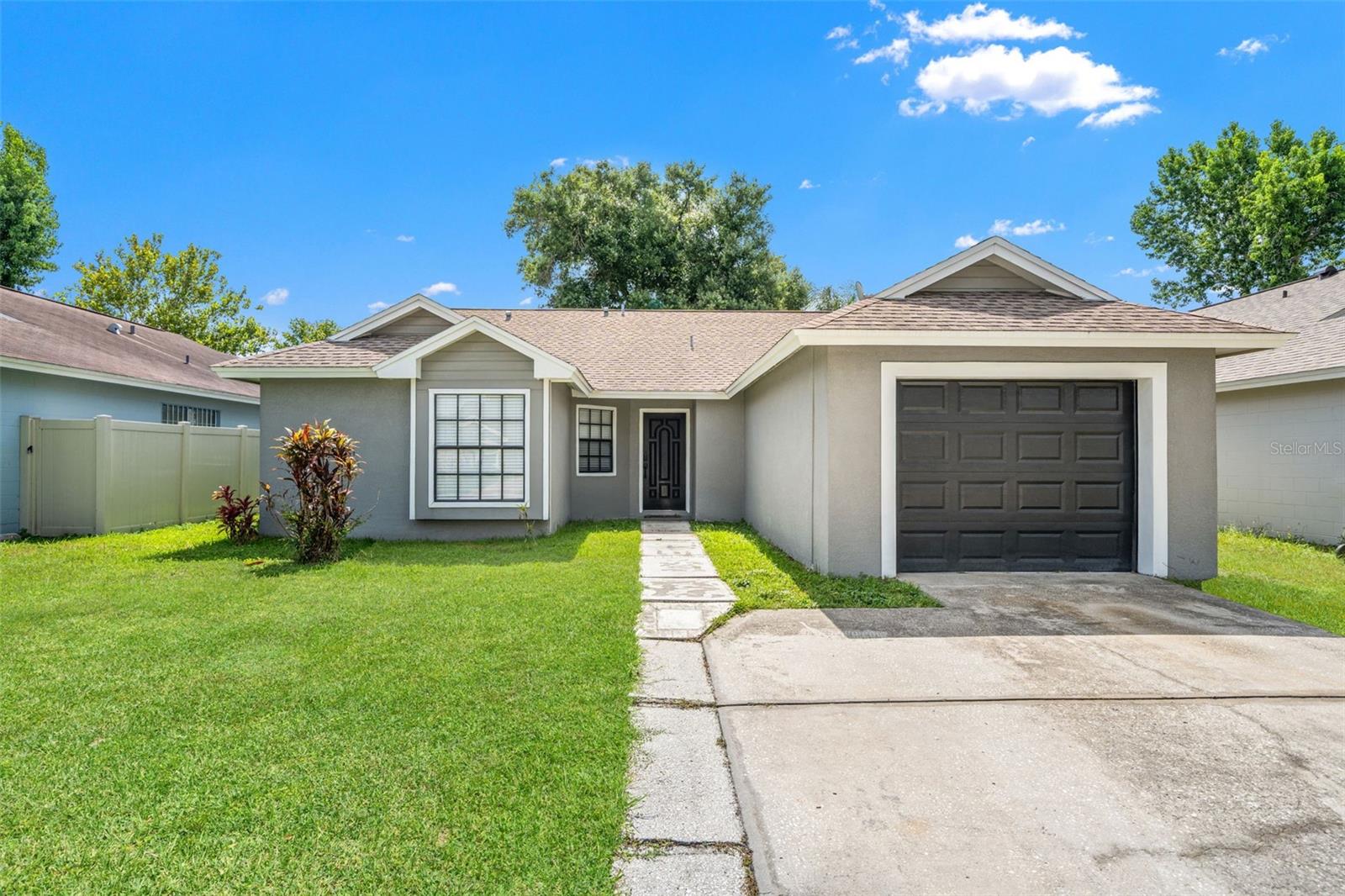 Welcome to this well-maintained 3 bedroom, 2 bath BLOCK home in the desirable Hampton Park community of Carrollwood. This home features a functional split-bedroom floor plan with tile flooring throughout, creating a clean, low-maintenance living space. The kitchen opens to the main living and dining areas, offering a comfortable layout for everyday living and entertaining. Enjoy peace of mind with a 2022 A/C system. Step outside to a fully fenced backyard, perfect for pets, outdoor gatherings, or simply relaxing in your own private space. Located in a community with no HOA restrictions and no flood insurance required, this home provides added flexibility and peace of mind. Conveniently located near the Veterans Expressway, Dale Mabry Highway, shopping, dining, parks, and top Tampa amenities, this home offers both comfort and convenience in an established neighborhood. Don’t miss this opportunity to own a home in the heart of Carrollwood!