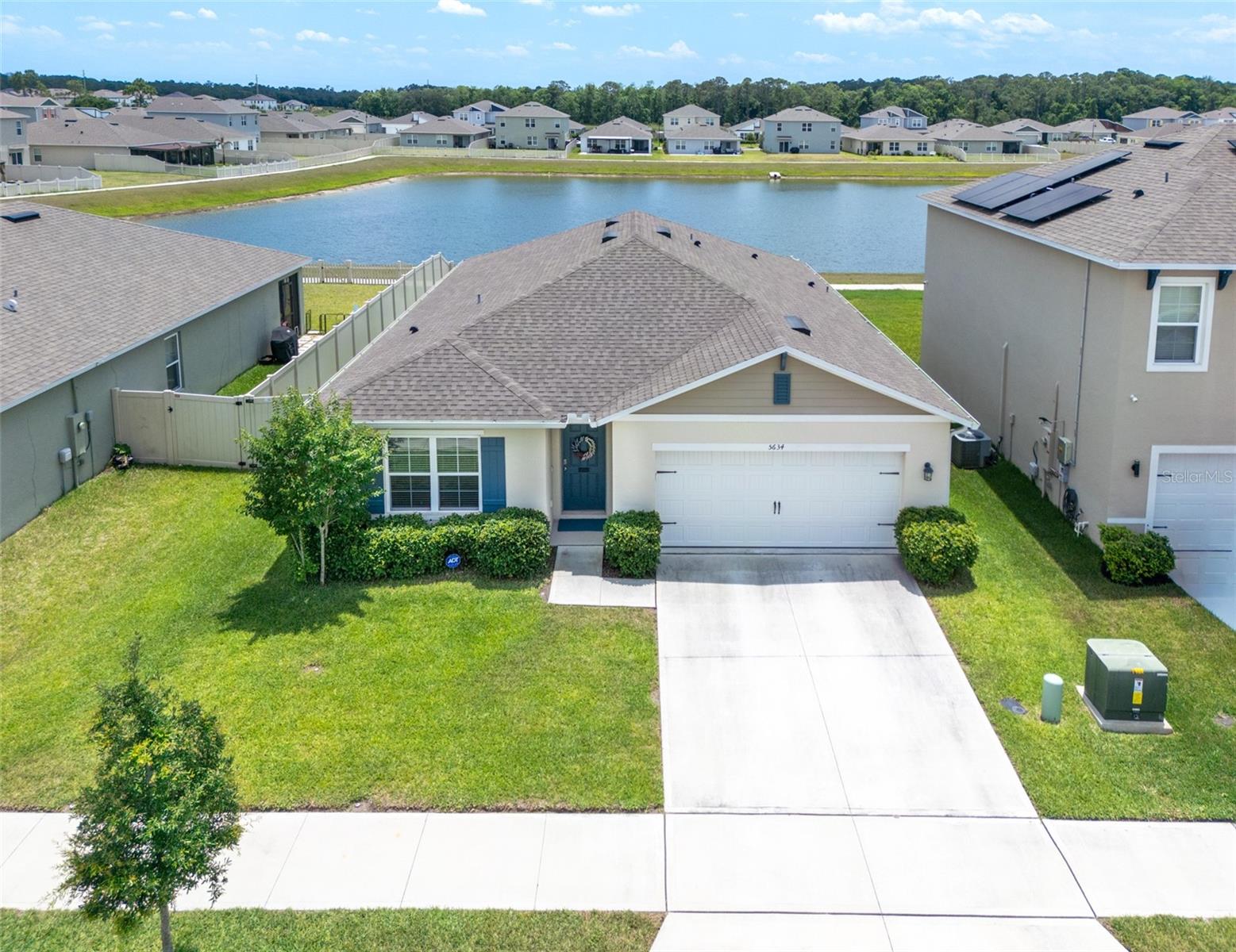 This Like-new 4 bedroom, 2 Bath home is situated on a scenic WATERFRONT lot with picturesque pond views. Natural light fills the spacious living area which seamlessly flows into the dining and kitchen areas and gives access to a screened patio and fenced in backyard - all perfect for enjoying time with family and friends. The chef-inspired kitchen boasts stone countertops, stainless steel appliances, a large island, 42-inch cabinets, and a huge step-in pantry offering ample storage. The split plan layout has the 3 secondary bedrooms near the front of the house and in the back, the large primary bedroom offers peaceful conservation views, an ensuite bath with dual vanities, a step-in shower, and walk-in closets. Outside, an outdoor OASIS awaits to enjoy time with family and friends from a private patio and a large, manicured backyard that offers plenty of room to enjoy the Florida outdoor lifestyle. Must see in person to fully appreciate every detail and the views from this rare home. With a low HOA and no CDD, this home offers easy access to schools, renowned hospitals (Lake Nona Medical City), major highways, and scenic hiking and biking trails. The Summerly community enhances your lifestyle with exceptional amenities, including a clubhouse, pool, and playground.