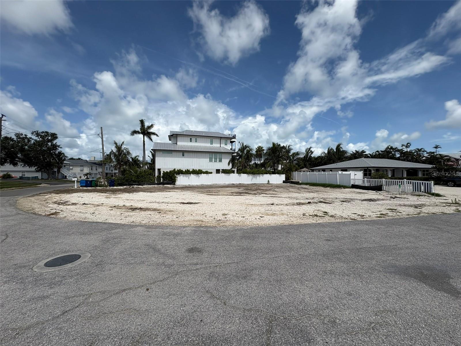 One or more photo(s) has been virtually staged. PRICE REDUCED FOR QUICK SALE!

PRIME OPPORTUNITY to build a custom coastal home on this 7,500 sq ft cleared corner lot in the heart of Holmes Beach on Anna Maria Island!

Ideally located just a short 6-minute walk to the Gulf’s white sand beaches, this property offers the perfect balance of lifestyle and long-term value. With a maximum building height of 35 feet, a future home could capture beautiful water views of both the Gulf of Mexico and the Intracoastal Waterway, creating a true elevated island living experience.

Positioned near local dining, shops, access to a community boat ramp for effortless days on the water. The location supports both everyday enjoyment and strong visitor appeal. Zoned for weekly rentals, the property provides flexibility for personal use, seasonal enjoyment, and income generation. Opportunities with this level of flexibility on Anna Maria Island are very limited.

Any renderings or home concepts shown are for illustrative purposes only and are not included in the sale. Buyers should conduct their own due diligence regarding design, permitting, and construction.

For investors: The combination of weekly rental zoning, walkable beach access, and potential water views creates a compelling opportunity to develop a high-demand vacation rental in a supply-constrained market.

For second-home buyers: Design a private coastal retreat tailored to your lifestyle, with the added benefit of generating income when not in use—allowing your beach home to work for you while you’re away.