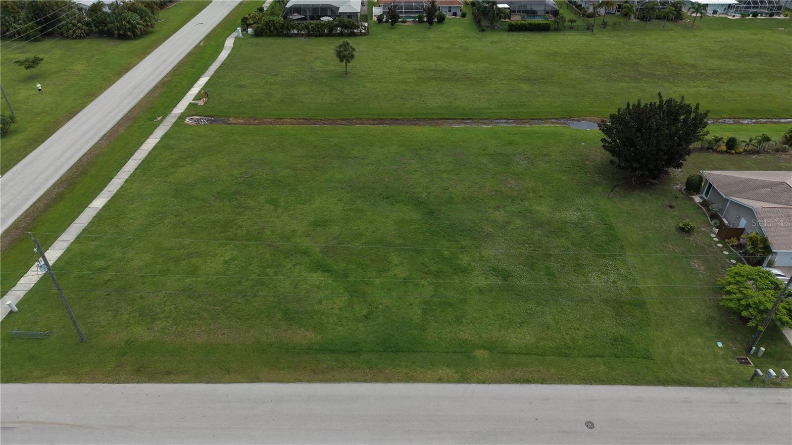 Rare Opportunity! Build your dream home on this oversized DOUBLE CORNER LOT in the highly sought-after, deed-restricted community of Burnt Store Meadows! With GM-15 multi-family zoning, city water and sewer, and ample space to bring your vision to life, opportunities like this are becoming increasingly difficult to find.

Surrounded by beautiful, well-maintained homes, this quiet, family-friendly neighborhood offers the perfect blend of privacy and convenience. Located just minutes from historic downtown Punta Gorda, you'll enjoy an incredible selection of waterfront restaurants, boutique shopping, parks, pickleball and tennis courts, walking and biking trails, vibrant community events, and the breathtaking Charlotte Harbor.

Outdoor enthusiasts will love the easy access to world-class boating, fishing, and kayaking, with Charlotte Harbor providing a gateway to the Gulf of Mexico. Pristine Gulf beaches, championship golf courses, and endless recreational opportunities are all within a short drive.

Ideally situated between Fort Myers to the south and Sarasota to the north, with Port Charlotte, North Port, Englewood, and Venice just minutes away, this location truly places the very best of Southwest Florida at your fingertips.

Whether you're ready to build your forever home, invest in one of Punta Gorda's fastest-growing communities, or take advantage of the property's flexible zoning, this exceptional homesite offers unlimited potential. Don't miss your chance to own a piece of paradise!