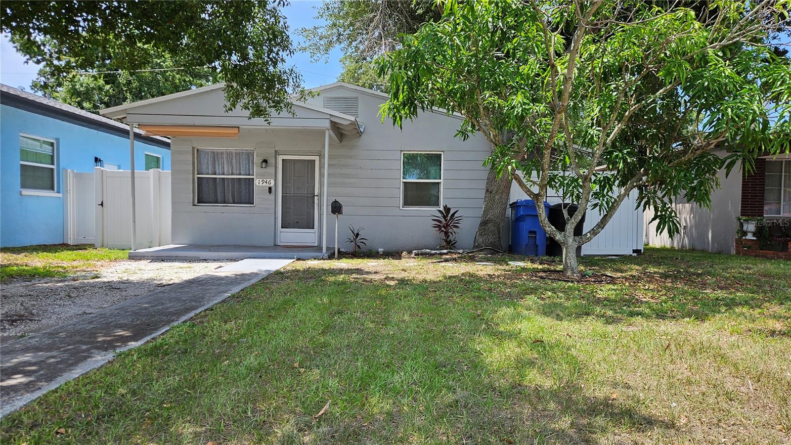 Some photos virtually staged. Charming home just minutes to downtown is available to put your own touches on it! Perfect for a starter home or those looking to downsize. This two bed, one bath home features a covered front porch for morning coffee and a cozy side area with decorative lighting for hosting. The backyard is fully fenced in with newer vinyl fencing including a storage shed, fire pit and minimal yard work. The kitchen and roof were both redone in 2021. Both the washer and dryer are included. A mango tree in the front yard is producing juicy mangos right now as well! Quick access to I-275 makes the beaches and everything St. Pete and Tampa have to offer an easy trip.
