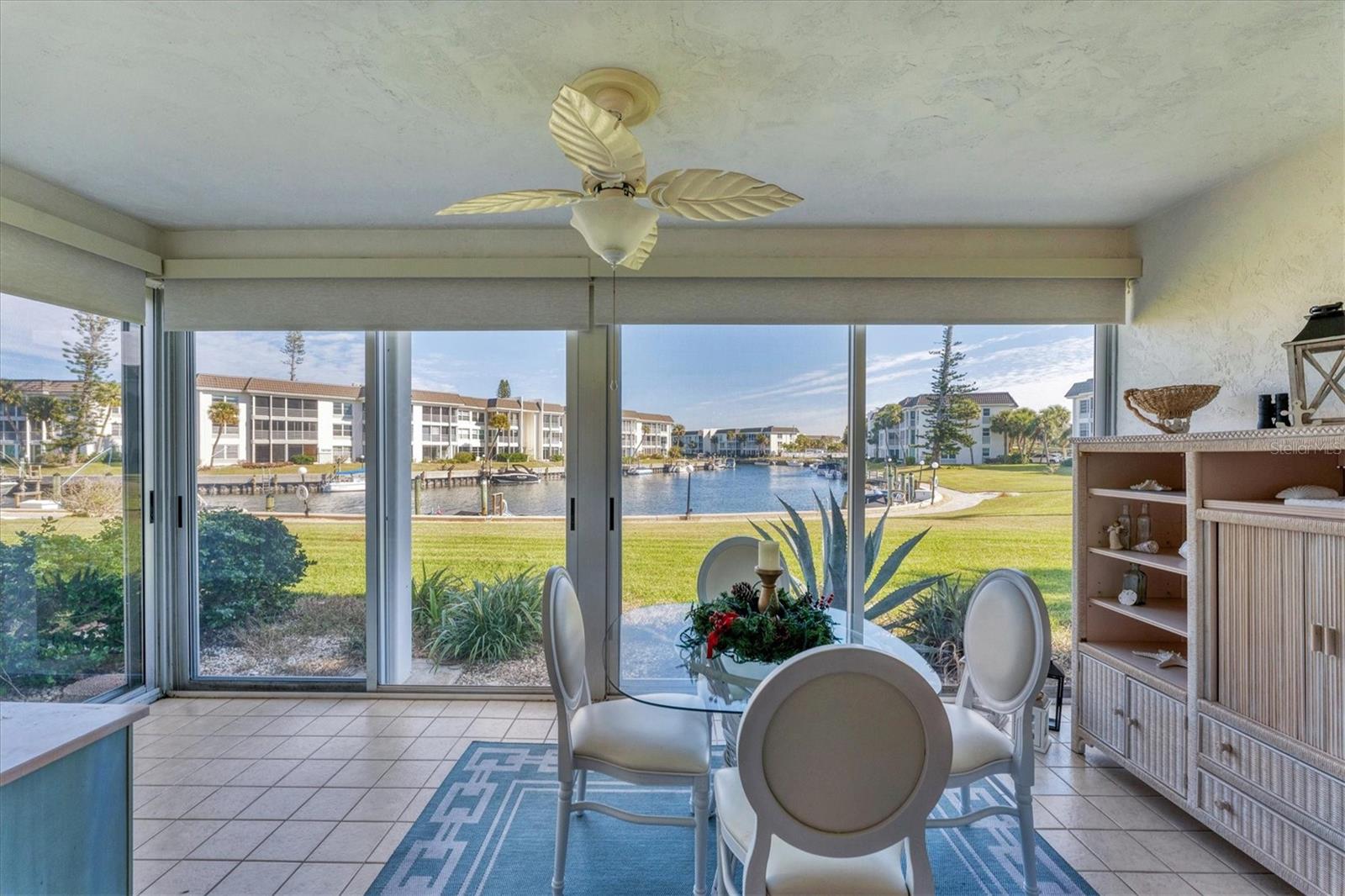 Light, bright, charming  and ready to move into! Kitchen gutted to studs, totally updated.
Tile floors, lots of closet space throughout. Updated baths,  Enclosed Lanai with tile floors and electric shades overlooks lovely water view. Lovely updated decor.   Furnishings are negotiable   . Longboat Harbour is amenity packed- 4 heated pools, tennis/pickleball, At the clubhouse/communinity center there is a full equipped gym with sauna and lockers, library, wood shop, kayak float/launch, social room, billiards room, shuffleboard. Great location! The community laundry room and pool are just around the corner and this unit in Building E has the shortest walk to the deeded beach access across the street, where there are restrooms and showers. Longboat Harbour is a very vibrant community with many social activites. An excellent rental as well. Call me for a showing.  No water intrusions post-hurricanes 2024.
