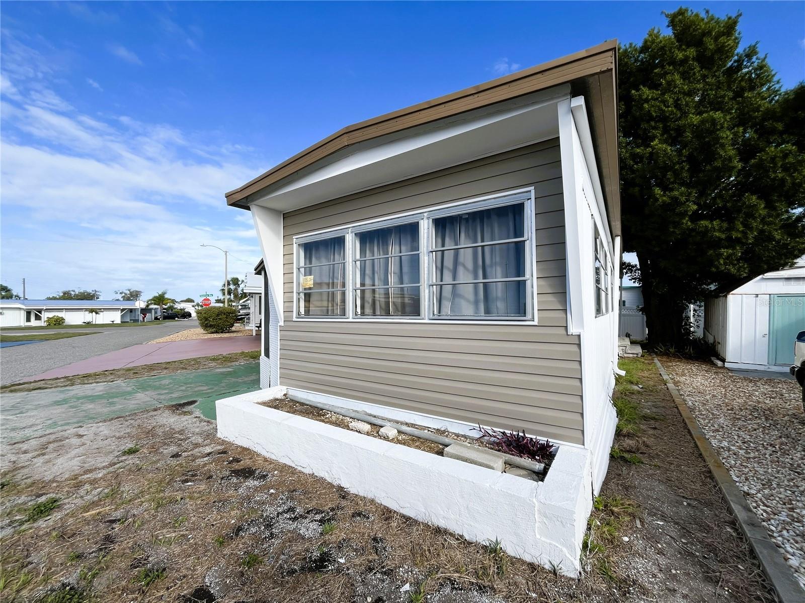Freshly updated and move-in ready, this inviting 1-bedroom home offers added flexibility with additional space that can be used as an office, guest room, or potential second bedroom. The layout provides comfortable living with room to adapt to your needs.

Recent updates include refreshed flooring, an updated bathroom, and additional improvements that give the home a clean, modern feel. The A/C has just been serviced, adding to the home’s overall readiness and peace of mind.

Whether you’re looking for a seasonal retreat or full-time residence, this home offers versatility, value, and easy living in the heart of the community.

Located in Trailer Estates, a Special Park and Recreation District governed under Chapter 418, Florida Statutes, residents own their land with no lot rent, CDD, or HOA fees. The annual park tax covers cable, high-speed internet, trash pickup, fire and rescue services, and access to outstanding amenities, including a marina with rentable boat slips, private beach, pool, hot tub, fitness center, shuffleboard, bocce ball, pickleball, woodshop, and nearly 60 active clubs and social events. Experience one of Sarasota Bay’s most vibrant and welcoming 55+ communities.