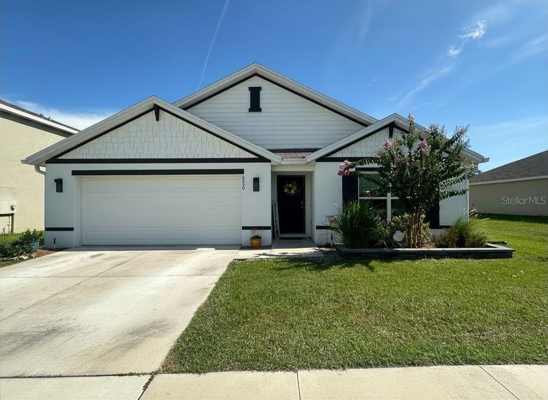 Perfectly located east of downtown Ocala, north of Baseline Park, & just south of the majestic Silver Springs State Park is the Deer Path North community. This community is zoned for Ward Highlands, an A rated public school.  This concrete block home has an open concept kitchen and huge island that looks into the family room. The modern kitchen island includes a beautiful deep stainless sink, built-in dishwasher, and water filtration system. There are new modern ceiling fans present in every room including the covered lanaie outside. The master bedroom has his and her sinks and plenty of closet space. Outside you will find a new enclosed vinyl fence, new gutters, irrigation system & beautiful landscaping. This home has smart technology available to control the thermostat and also view who is at your front door. D.R. Horton properties have a 10 year structural warranty. Come see why this part of Ocala is full of Old Florida Charm.