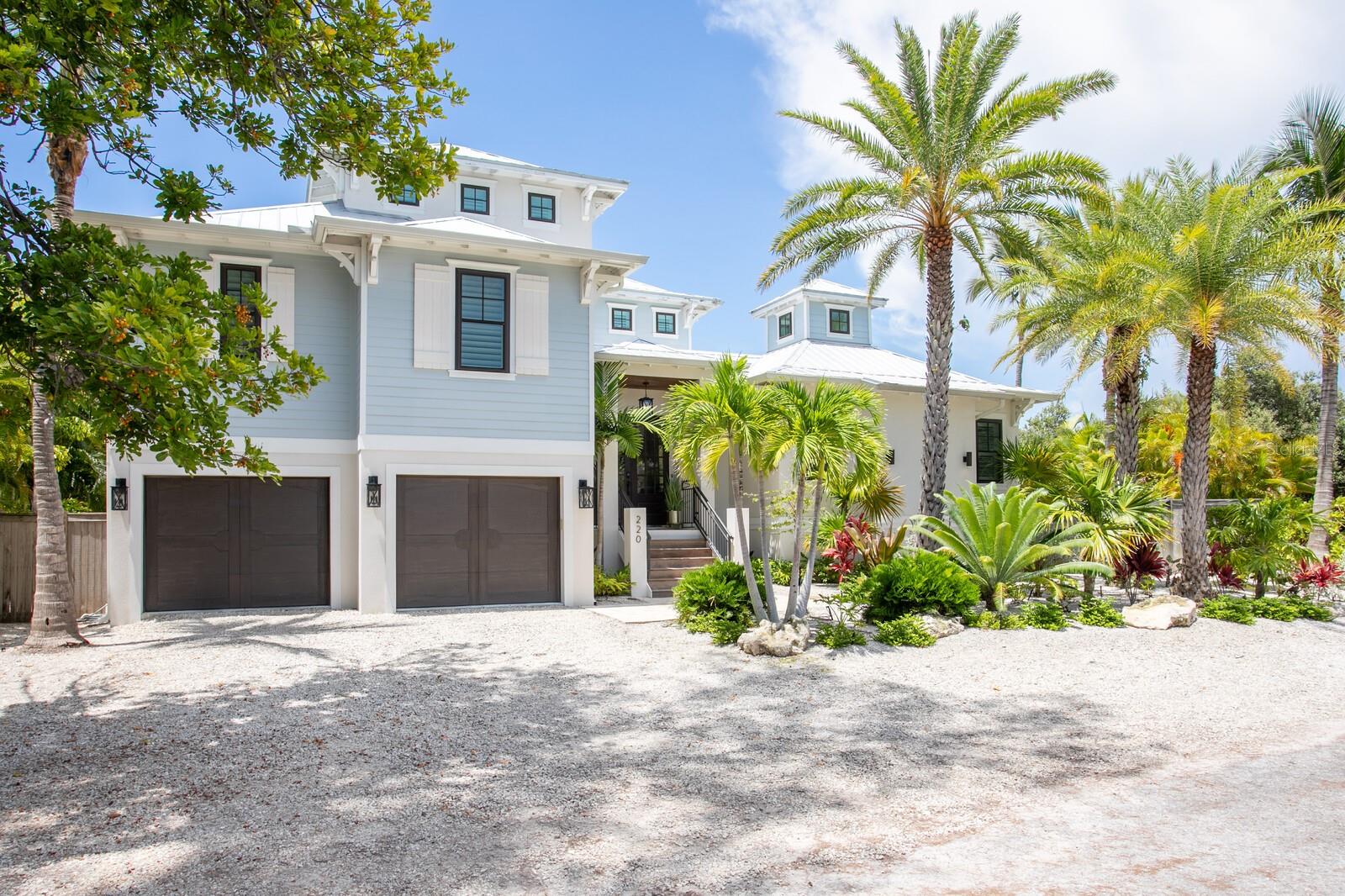 Welcome to one of Anna Maria Island's most extraordinary waterfront estates, where timeless coastal elegance meets world-class boating and resort-style living. Perfectly positioned on a nearly ¼-acre corner lot with breathtaking open water frontage, this custom-built residence offers an exceptional combination of privacy, luxury, and direct access to Tampa Bay.

Designed for both full-time living and luxury vacation rental potential, the home features 4 spacious en suite bedrooms, each with its own private bath. Expansive open-concept living space feature soaring ceilings, designer finishes and walls of glass capturing panoramic water views.  The open kitchen has a separate butler's pantry, Thermador Appliance package and seamlessly connects indoor and outdoor living areas. 

Step outside to your private tropical retreat featuring a heated saltwater pool and spa, covered outdoor living spaces, and a fully equipped outdoor kitchen designed for effortless entertaining. Lush landscaping creates a tranquil island setting, while the waterfront becomes the centerpiece of the property. 

For boating enthusiasts, the property offers a private dock with a 20,000-pound boat lift and direct boating access to Tampa Bay and the Gulf of Mexico with no fixed bridges, making it ideal for everything from offshore fishing to sunset cruises.

Take your golf cart to the white sand beaches, dining and shopping.  Have peace of mind with 4 newer HVACs. This exceptional residence offers the rare opportunity to own a premier waterfront property that serves equally well as an exclusive private retreat or a high-performing luxury vacation rental.