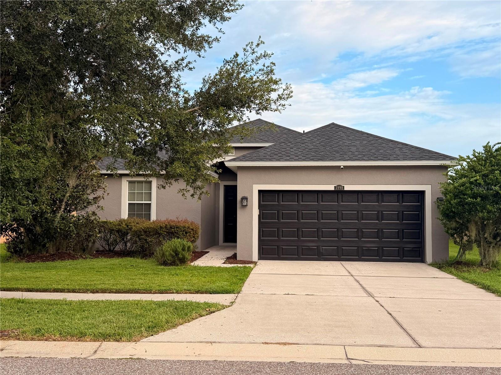 PRICED TO SELL IMMEDIATELY! Bring your offers to this highly motivated seller and capture incredible value in the heart of Wesley Chapel! Located in the highly sought-after, NO-CDD community of Ashton Oaks, this beautiful 3-bedroom, 2-bathroom home offers the perfect blend of modern efficiency and low-maintenance living. Built with solid concrete block construction, the interior features an expansive open floor plan seamlessly connecting a bright great room to the functional kitchen—all appliances included! Enjoy sleek tile flooring flowing throughout the main living spaces and a serene water view from your backyard oasis. Nestled in a premier location just minutes from top-rated schools, premier shopping, and dining, with lightning-fast access to I-75. Fast closing and flexible terms are available for qualified buyers. Do not wait—schedule your private tour today before this exceptional opportunity is gone!