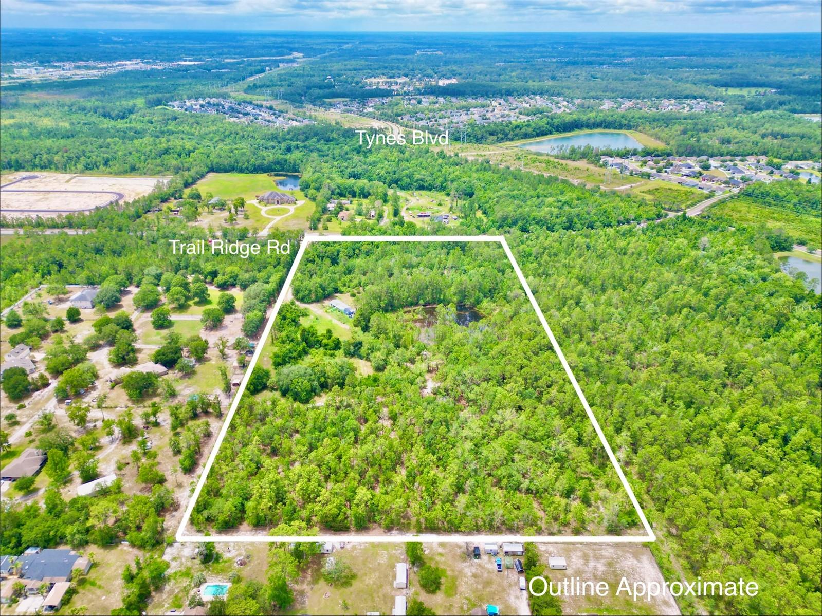 Investor and developer opportunity in one of Northeast Florida’s fastest-growing corridors! This 20-acre propety offers exceptional potential for residential development, with ample upland acreage well-suited for subdivision into approximately 1/4-acre homesites (subject to zoning, engineering, and county approvals). The property features valuable hard road frontage on Trail Ridge Road, providing excellent access and visibility. A scenic on-site pond offers both aesthetic appeal and potential utility as part of a future stormwater management and drainage plan. Adding immediate value, the property includes two habitable residences that could provide rental income, serve as temporary housing during development, or support project operations. Conveniently located in the growing community of Middleburg, the property offers an attractive balance of rural character and urban accessibility, with easy commutes to Orange Park, Jacksonville, and major employment centers throughout Clay and Duval Counties. As population growth continues to drive housing demand west of Jacksonville, opportunities of this size, location, and development potential are becoming increasingly difficult to find. Buyer to verify all zoning, land use, density, subdivision, and development requirements.