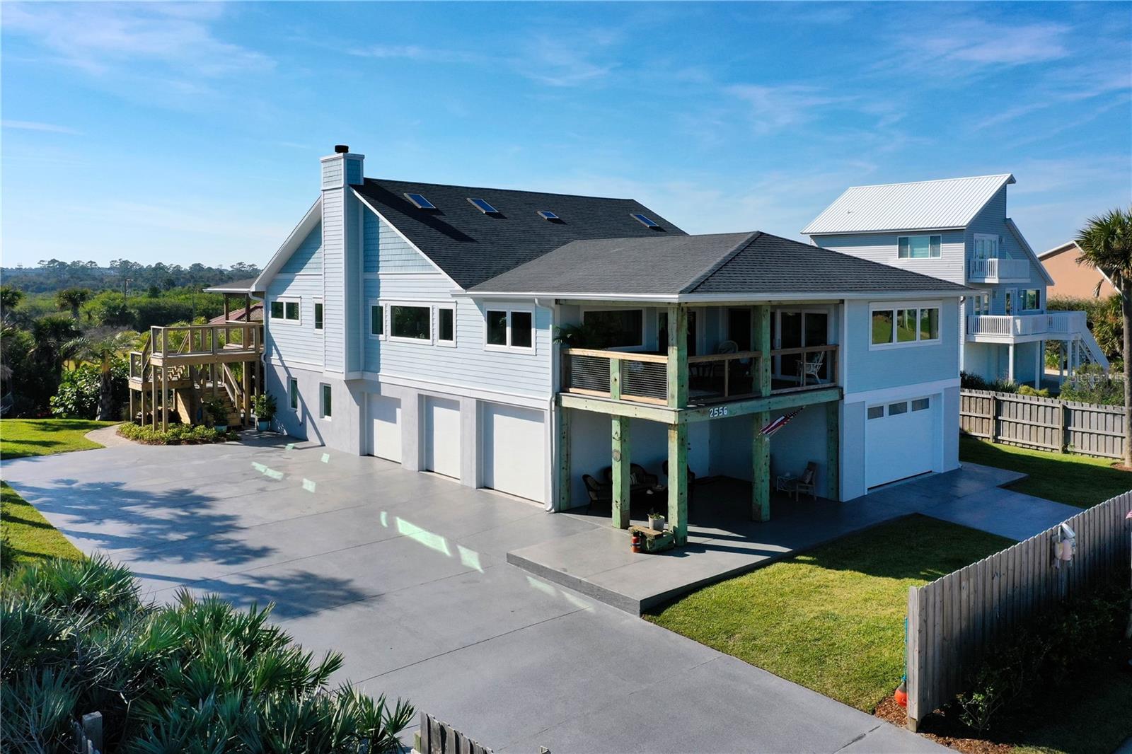 Welcome to your One-of-a-Kind Oceanfront Private Estate – A Craftsman Masterpiece

If you have been dreaming of an oceanfront retreat that blends timeless craftsmanship with modern luxury and long-lasting quality, this home is ready to welcome you. Every sunrise and sunset will take your breath away. This coastal estate, thoughtfully redesigned from the ground up, highlights exceptional craftsmanship and prioritizes both comfort and attention to detail across two stories. Experience coastal living at its absolute finest in this custom-built, PRIVATE one-of-a-kind two-story oceanfront estate—with no detail overlooked. 

Inside this entertainer’s dream home, you will find five spacious bedrooms (four with its own ensuite), plus two half baths and laundry rooms on each floor for ultimate convenience. The chef’s kitchen is a showstopper — featuring a gas range, two dishwashers, a huge Island, countertops galore and a massive walk-in pantry. 

This home has Expansive Entertaining Spaces with an Open-concept living area, featuring a wood-burning fireplace, diverse seating arrangements and dining areas, billiards parlor, library and office. The abundant natural light from the large picture windows and skylights show off the gorgeous hardwood floors. The view of the Atlantic Ocean is absolutely stunning from nearly every window. Transcend from the open and airy living space onto the expansive East and West decks to enjoy ocean sunrises and stunning sunsets that will truly blow your mind.

Built with durability and quality at every turn, the home boasts genuine reclaimed lumber from the iconic Flagler Pier, custom-milled blue stain pine ceilings, hardwood oak floors, tongue, and groove pine & cypress plank, custom cedar closets, Trex Dex, Hardi Board siding and skylights. Thoughtfully designed for longevity, the hurricane-proof windows and doors are only the beginning. 

The oversized 4½ + Auto/Truck garage and workshop are a seamless continuation of the house highlighting stunning blue stain pine ceilings and polyaspartic coated floors, driveway, porches, and pool deck. The professionally landscaped, half-acre resort-style property with irrigation and private well includes a sparkling pool, plenty of room for relaxation and entertainment, an outdoor shower and a spacious driveway to accommodate you and your guests.

Rest assured that every aspect, from the roof to the electrical system, plumbing, framing, HVAC, whole house water filtration system and instant hot water heater, is carefully built with durability in mind. The home is fully wired with a whole-house Marantz surround sound system (including marine-grade outdoor speakers on the decks), and it is designed to stand strong against coastal elements.

This is not just a home; it is a legacy. Designed for durability, comfort, and unforgettable entertaining, every inch reflects true craftsmanship and a love for oceanfront living.
Flagler Beach, FL is a laid-back, golf-cart-friendly coastal town where getting around is half the fun. Cruise between restaurants, coffee shops, ice cream parlors, and shops, many with cart parking. With dog-friendly beaches and a vibrant culinary scene, it’s an easygoing, old-school Florida beach town.

Ready to experience the ultimate in coastal luxury? Contact us to schedule your private tour and discover the home that will exceed every expectation.


**SHORT TERM RENTALS ARE ALLOWED IN BEVERLY BEACH WITH A LOCAL BUSINESS TAX LICENSE**