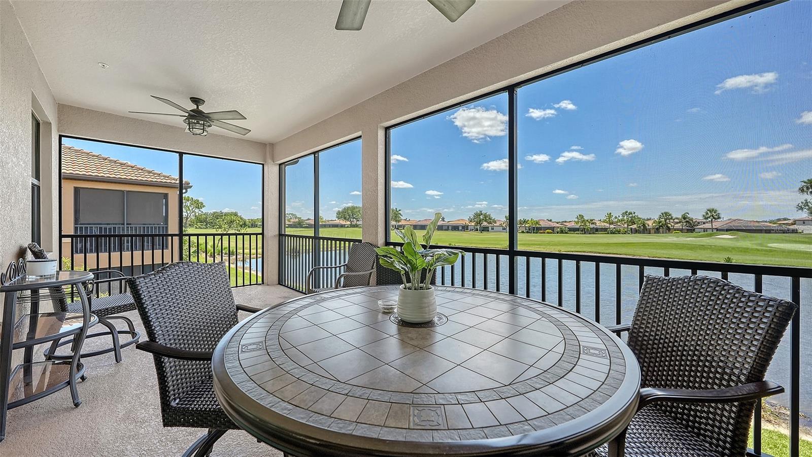 Welcome to your dream retreat at 6614 Grand Estuary Trail, Unit 102, nestled in the heart of the River Strand Golf and Country Club in Bradenton, Florida. This stunning, fully furnished second-floor coach home boasts over 2,100 square feet of meticulously designed living space, offering the comfort and privacy akin to a single-family home, all while being move-in ready for your convenience.  Also feel safe and sucure with Hurricane Impact Windows and Doors.  A/C was recently serviced and the heating element was replaced.

Step inside to discover an inviting great room that provides ample space for various seating arrangements, effortlessly flowing into the dining area—perfect for entertaining friends and family. The heart of the home is undoubtedly the well-equipped eat-in kitchen, featuring a breakfast bar that invites casual dining. The expansive lanai at the rear of the home is newly screened with No-seeum's screening, is a true showstopper, framing breathtaking water views that are a hallmark of River Strand living. The double sliding doors and generous windows bathe the entire space in natural light, enhancing the serene ambiance and showcasing the picturesque scenery.

Retreat to the spacious owner's suite, complete with direct access to the lanai, an en-suite bathroom, and not one but two walk-in closets—offering both luxury and functionality. On the opposite side of the home, you’ll find two well-sized guest bedrooms that double as perfect home office spaces, accommodating your lifestyle needs effortlessly. This model also features plenty of storage options and a tandem two-and a half car attached garage, providing ample space for your vehicles and belongings.

Recent updates to River Strand have enhanced the community's charm and appeal, including upgraded amenities and revitalized common areas that foster a vibrant lifestyle. Residents enjoy access to 27 holes of Arthur Hills-designed golf, a lavish clubhouse with a restaurant and grille room, two community pools and spas, a tiki bar, six satellite pools, and two fully equipped fitness centers. Engage in friendly competition on the tennis and pickleball courts or participate in a variety of social activities designed to build connections within this welcoming community.

Perfectly situated just minutes from I-75, this home offers easy access to shopping with Costco, Academy, Hobby Lobby and Super Target right around the corner, dining such as Miller's Ale House, Seasons 52 and LongHorn Steakhouse just to name a few, and the stunning beaches of the Gulf Coast. A rare find in a beautiful community, this coach home is not just a place to live—it's a lifestyle waiting to be embraced. ***Patio Furniture does not convey***