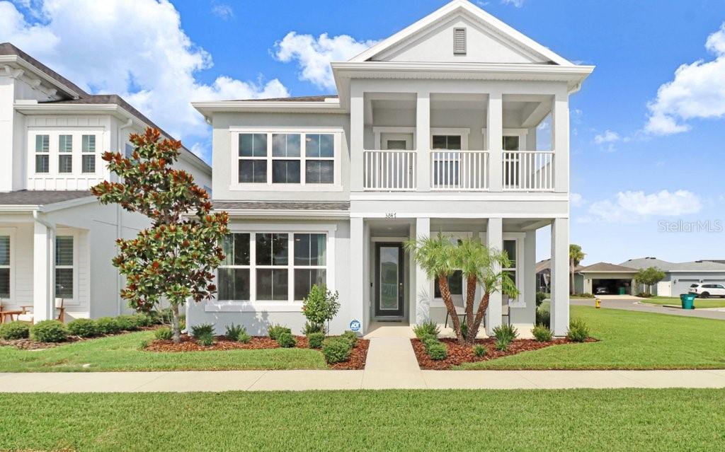 Say YES to the address! Nestled in the heart of Wesley Chapel, this stunning ICI Primrose floorplan is ready for you to call HOME. If multigenerational living is your goal, get ready to check the boxes.  Featuring 4 bedrooms and 3 full bathrooms, this thoughtfully designed home has the primary and a secondary bedroom located on the first level.  The open-concept layout, with vaulted ceilings, and expansive windows flood the home with tons natural light. Love to entertain....do so effortlessly in this gourmet kitchen with stunning backsplash, a black stainless-steel refrigerator, quartz countertops and a massive center island. Upstairs you will find 2 additional bedrooms, a full bathroom and a nicely sized loft area; perfect for family game-night, movie night or simply snuggling up with a good book:) The screened in patio is perfectly centered off the dining & living room, creating a perfect indoor-outdoor living space.  It features high ceilings, a summer kitchen rough-in awaiting your creativity, and an oversized screened door that provides access to a perfectly pavered walkway leading directly to your drive-way. Located on an oversized corner lot, you'll have nearly 22 feet of side yard to kick a ball, play fetch with Fido or simply enjoy some Florida sunshine. The HVAC system has been thoughtfully upgraded with a whole-house electronic air cleaner, dual UV lamps, a condenser hard-start kit, and surge protection - enhancing indoor air quality, reliability, and long-term system protection. A professionally installed generator inlet box provides convenient connection for a portable generator during power outages and exterior gutters will keep the mind at ease diverting water during our storm seasons.  The low HOA includes cable & internet, a resort style pool, playground, a dog park and endless sidewalks that lead directly to the Wiregrass Sports Complex. Persimmon Park residents enjoy convenient access to Primrose School at Wiregrass, The Shops at Wiregrass, AdventHealth, BayCare Hospital, Cooper's Hawk Winery & Restaurant, PHSC, highly desired schools and the exciting future Downtown Wesley Chapel development. Only 3 miles to i75 makes for a quick commute to Downtown Tampa or Tampa International Airport.  Refrigerator in garage and washer/dryer will convey. Don't miss out on the perfect place to call HOME!!
