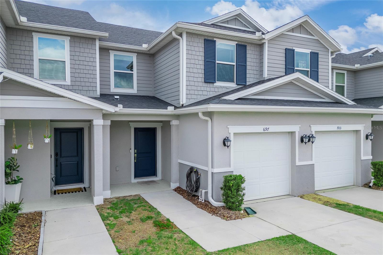 This beautifully upgraded townhome, located near Champions Gate, combines convenience and modern style. Featuring 3 spacious bedrooms, 2.5 baths, and stunning laminate flooring throughout, it offers both comfort and elegance. The remodeled bathrooms are sleek, and the kitchen showcases luxurious countertops, 36-inch upper cabinets, and stainless-steel Samsung appliances. A spacious one-car garage and a convenient powder room on the first floor add to the home's functionality. Upstairs, enjoy a dedicated laundry area and a primary suite with a dual-sink vanity and spacious closet. With ample storage and high-end finishes, this townhome offers the perfect blend of modern living in a prime location. Please note, closing timelines may be longer than initially expected.