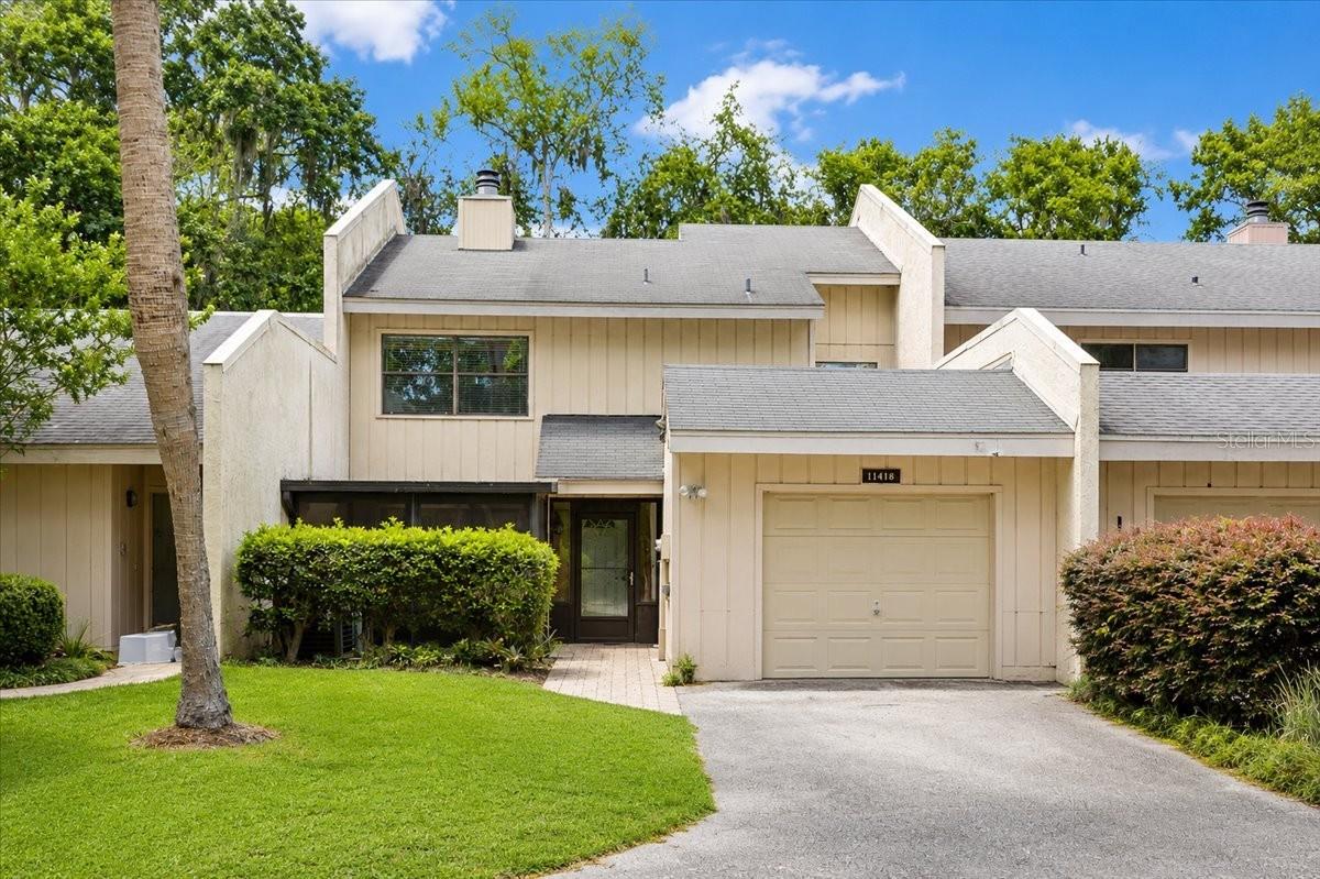 Virtually Staged. Welcome to the perfect blend of resort-style living and peaceful natural beauty in the highly sought-after gated community of Turkey Creek.

This spacious 3-bedroom, 3-bathroom townhome with an attached garage offers an exceptional opportunity to enjoy one of Alachua's most desirable communities at an affordable price. This well-priced residence is an ideal way to experience everything Turkey Creek has to offer while enjoying the ease of low-maintenance living.

Inside, soaring two-story ceilings and dramatic floor-to-ceiling windows fill the living room with natural light and frame tranquil views of the pond beyond. Whether you're enjoying your morning coffee on the screened front porch or unwinding on the screened back porch, you'll love the peaceful setting where birds, deer, and other native wildlife are frequent visitors.

The thoughtful floor plan includes a bedroom and full bathroom on the main level, perfect for guests, a home office, or multigenerational living, while two additional bedrooms and two full bathrooms are located upstairs, providing privacy and flexibility. 

Life in Turkey Creek means more than just owning a home, it's embracing a lifestyle. Residents enjoy a beautifully maintained gated community featuring an 18-hole golf course, clubhouse with restaurant, swimming pool, tennis courts, parks, walking paths, and an abundance of green space. Conveniently located just minutes from Gainesville, you'll enjoy the perfect balance of everyday convenience and a quiet, nature-filled setting.

If you've been dreaming of an affordable home in one of North Central Florida's premier golf course communities, this is your opportunity. Schedule your private showing today and discover why so many people love calling Turkey Creek home.