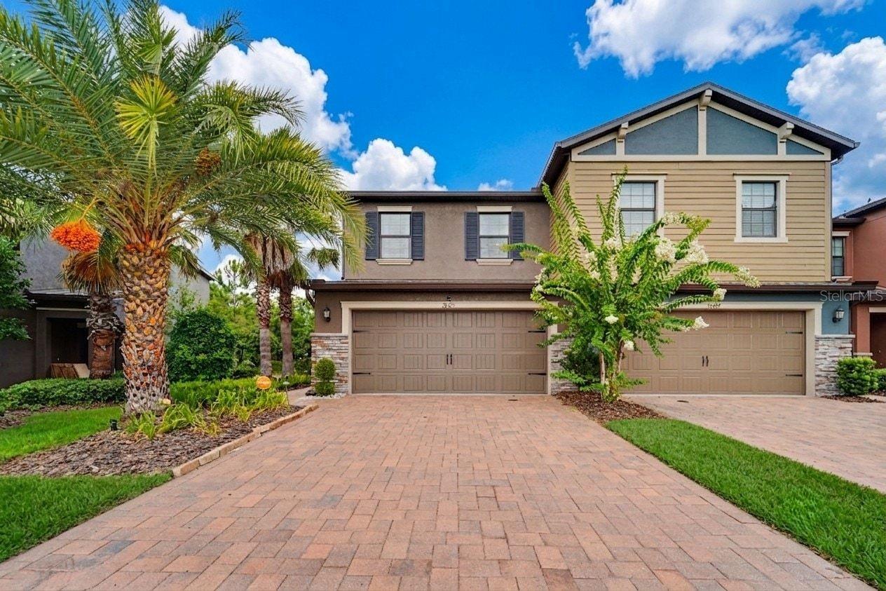STOP SCROLLING. ONE ORIGINAL OWNER. IMMACULATE CONDITION. THIS IS THE ONE! Imagine sipping your morning coffee on a private screened patio — sun perfectly filtered by an added shade screen — while a serene pond mirrors the Florida sunrise and wildlife drifts lazily across the conservation view behind you. No rear neighbors. No yard work. No waiting to build. Just move-in ready, maintenance-free luxury in one of Wesley Chapel's most beloved communities — and it's been waiting for exactly the right buyer.

Welcome to 28425 Pleasant Bay Loop at the Arbors at Wiregrass Ranch, where seven years of meticulous original-owner care have kept this stunning Capri floor plan townhome in showroom condition. At 1,801 sq ft with 3 bedrooms, 2.5 baths, and a 2-car garage, every inch of this home reflects pride of ownership that simply cannot be replicated.

The open-concept main floor is made for real life — impressive foyer entry with wide-plank oak luxury vinyl flooring flowing throughout, leading into a chef-worthy kitchen featuring custom staggered 42" cabinets, granite countertops, stainless steel appliances, a large breakfast bar, and a walk-in pantry built for the way families actually live. Step outside to your private screened patio and let that breathtaking pond view do the rest.

Upstairs, the primary suite delivers the retreat you deserve: a sitting area, garden soaking tub, oversized walk-in shower, granite countertop with dual sink vanity, and a walk-in closet worthy of a standing ovation. Two additional bedrooms and a full hall bath complete the upper level.

Here's what truly sets this home apart: **BLOCK on-BLOCK construction on BOTH floors** — superior durability, quieter living, better energy efficiency, and lower insurance costs. At this price point in Wesley Chapel? That is rare.

And the location? An absolute 10. Step outside and you are literally next door to the community pool and cabana — we're talking steps, not a walk. Start your morning on the wetland and pond walking trails winding through Wiregrass Ranch, then unwind at Wildflower Park or Tranquility Park. Catch a movie under the stars at Porter Park's community movie screen, and let your four-legged family members burn energy at Central Bark Dog Park. This community doesn't just have amenities — it has a lifestyle.

Beyond the gates, Wiregrass Elementary, Dr. John Long Middle, and Wiregrass Ranch High School are all within 1.5 miles — among Pasco County's most coveted schools. The Wiregrass Ranch Sports Campus is 3 minutes out, The Shops at Wiregrass and premier dining just 5 minutes away, and seamless I-75 access puts Downtown Tampa and TIA a smooth 30–35 minutes from your front door.

Your HOA covers the pool, exterior maintenance, grounds, exterior paint, roof replacement, and trash — so your weekends stay completely, gloriously yours.

**Original owner. Immaculate inside and out. Steps from the pool. And a pond view that will stop you in your tracks.**

Homes like this don't wait. Book your appointment and make it yours before someone else does.