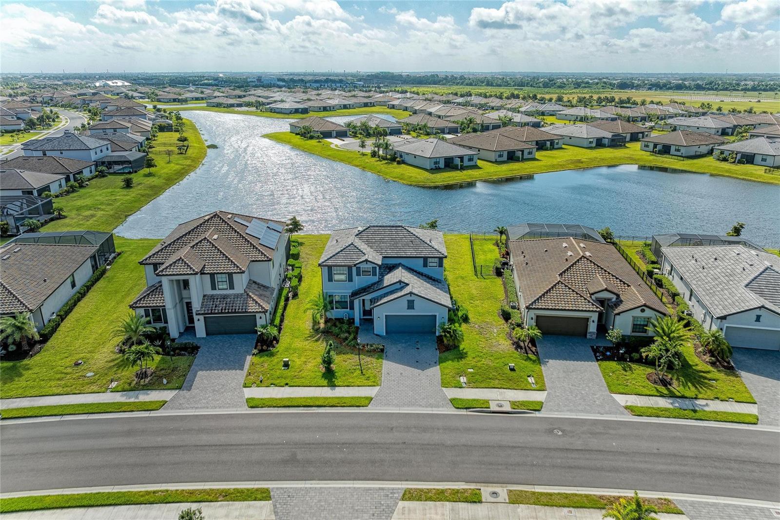 Welcome to your dream oasis in the vibrant, master-planned community of Lorraine Lakes at Lakewood Ranch! This beautiful two-story home offers the perfect blend of spacious living and a maintenance-free resort lifestyle, complete with a picturesque lake view that will steal your heart. From the moment you step inside, you will appreciate the bright and airy open-plan kitchen and family room combination, seamlessly designed for everyday living and easy entertaining. The main living areas feature durable, stylish tile flooring, while a ceiling fan keeps the space cool and comfortable. Open the sliding glass doors from the family room to step out onto your private lanai, where you can unwind and take in the serene water views. The main level also includes a convenient first-floor bedroom, perfect for guests or a home office, alongside a full bathroom. Outside, the backyard provides an impressive amount of space, offering plenty of room to add your own private pool down the road.

Head upstairs to discover a versatile second-floor family area, also equipped with a ceiling fan, creating the ideal spot for a movie night, play space, or home office. Three bedrooms are located on this level, featuring cozy carpeting and individual ceiling fans for personalized comfort. The spacious primary suite serves as a true retreat, boasting a generous walk-in closet and a private ensuite bathroom complete with dual sinks and a large shower.

Living in Lorraine Lakes means embracing a true vacation-at-home lifestyle. This premier community is renowned for its incredible resort-style atmosphere, where a full-time lifestyle director curates an exciting, vibrant calendar of events and activities for all residents. Spend your weekends lounging by the sparkling community pool, grabbing a refreshing drink at the poolside bar, or perfecting your game on the putting green. For those who love to stay active, the options are endless with tennis, pickleball, and beach volleyball courts, alongside a state-of-the-art fitness center that even includes an indoor basketball court. Families will also love the dedicated playground and diverse recreational facilities designed to keep everyone engaged. True convenience is built right in, as the HOA fees generously cover your internet and cable, professional lawn maintenance, and full access to all these spectacular amenities. Do not miss this rare opportunity to enjoy luxury master-planned living in the heart of Lakewood Ranch. Schedule your private showing today and discover why this spectacular property is the perfect place to call home!