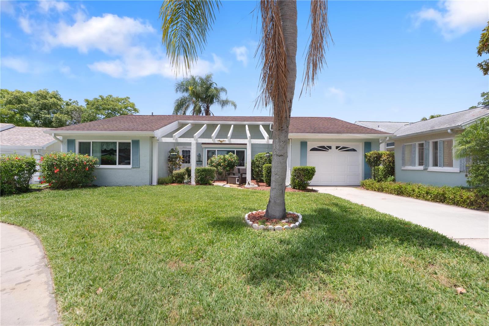 Located on a quiet cul-de-sac, this beautifully maintained 2-bedroom, 2-bathroom residence in the sought-after Beacon Woods community offers a thoughtful blend of comfort, functionality, and modern updates. Move-in ready and meticulously cared for, this home is sure to impress.

Recent improvements include new hurricane-impact windows installed in 2026 in both bedrooms, the living room, and family room. The home features luxury waterproof vinyl plank flooring, a whole-house water softener that was rebedded in 2023, and a reverse osmosis system in the kitchen. A convenient buffet in the kitchen provides the perfect space for a coffee station, beverage center, or additional countertop workspace.

The updated guest bathroom showcases porcelain tile, pebble stone mosaic accents, brushed nickel fixtures, a newer vanity, tub, and toilet. Relax and enjoy Florida living in the spacious sunroom, ideal as a flex space, home office, hobby room, or additional living area. Step outside to the screened lanai featuring attractive river rock flooring, durable pet-resistant screening, and a hot tub that conveys with the sale—perfect for unwinding after a long day.

Additional highlights include a finished one-car garage, a full attic providing abundant storage space, newer rear gutters, a two-zone irrigation system, security camera system, transferable GAF shingle warranty, and a professionally painted and sealed exterior that enhances both curb appeal and long-term durability. For added peace of mind, the home also comes with a HOME WARRANTY covering major systems, including the air conditioning, heating, plumbing, and electrical systems.

Residents of Beacon Woods enjoy access to outstanding community amenities, including an 18-hole golf course, swimming pool, tennis courts, pickleball courts, shuffleboard courts, and a clubhouse offering a variety of social and recreational activities.

Conveniently located near shopping, dining, parks, and everyday amenities, this well-cared-for home offers an exceptional opportunity to enjoy the Florida lifestyle in an established golf course community.
