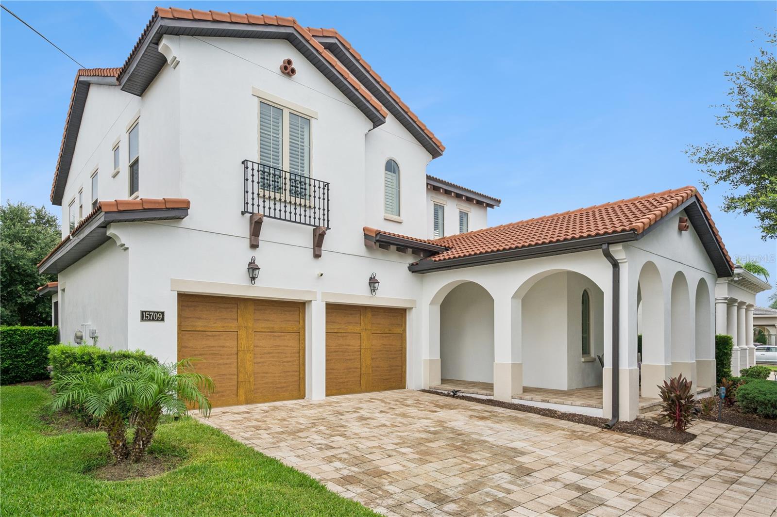 Welcome to this stunning Toll Brothers Sanibel Spanish Colonial model, where timeless architecture meets modern luxury in the highly sought-after Lakeshore Preserve community. Distinguished by its elegant tile roof and thoughtfully designed floor plan, this exceptional home offers the perfect blend of sophistication, comfort, and functionality.
Step inside to discover a massive great room that serves as the heart of the home—an inviting space designed for both everyday living and unforgettable entertaining. The gourmet kitchen is a chef's dream, featuring a natural gas range, oversized center island, abundant cabinetry, and seamless flow into the living and dining areas.

Two expansive sliding glass doors, complete with custom blinds, open to a covered and screened lanai, creating the ideal indoor-outdoor living experience for relaxing or hosting guests year-round.
The first floor also includes a versatile fourth bedroom or private home office with an adjacent full bathroom, providing flexibility for guests, multigenerational living, or remote work.

Upstairs, the luxurious primary suite offers a peaceful retreat with large windows that fill the room with natural light. The spa-inspired primary bath features a soaking tub, separate walk-in shower, dual vanities, and twin walk-in closets. Two additional bedrooms, a spacious loft perfect for a media room or play area, and a convenient second-floor laundry room complete the upper level.

Additional upgrades include a tankless water heater and a spacious two-car attached garage with ample room for vehicles and storage.
Living in Lakeshore Preserve means enjoying a low-maintenance lifestyle with HOA dues that include lawn care, internet, and cable. Residents also have access to an impressive collection of resort-style amenities, including a clubhouse, swimming pool, fitness center, playgrounds, sand volleyball courts, dog park, firepit, and kayak launch.

Experience luxury living, exceptional amenities, and an unbeatable location in one of the area's most desirable communities.