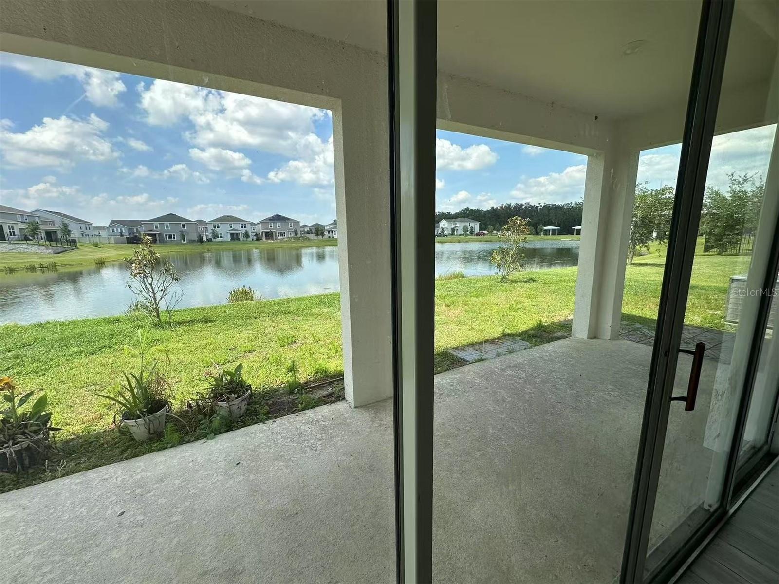 Summer special for quick move in on or before 7/15! Welcome to this NextGen model, one of the most unique model with a seperate unit/suite with next-gen bedroom, next-gen living room ,cafee/kitchen downstairs with a seperate entrance! Fantastic water view and water access to the big lake! Tons of upgrades including granite counter top, upgraded kitchen cabinets, stainless steel appliances, etc. There are total of five bedrooms, three and half bathrooms and a three car garage, that is designed for growing families, most suitable with 2 generations. Additional rooms include an oversized loft, breakfast nook and an upstairs laundry room for added convenience. The master suite has a luxurious walk in closet, master bathroom with bathtub, his and hers sinks, and a walk in shower. There is also a large covered patio to enjoy the views and the outdoors all year long. Hanover Lakes is a much sought after waterfront community. Perfect for boating, fishing and enjoying nature. Amenities to include: Dock and lift to the Chain of Lakes, Splash Park, Resort Style Swimming Pool and Cabana. Hanover Lakes’ also has a great location,it is just 15 miles from Lake Nola Medical City, and 6 miles awat away from the Florida Turnpike with tons of shopping and dining options such as Harmony Farmers Market, it is convenient to get anywhere you need. Your family will love living and creating memories together at Hanover Lakes. There is a solar system rented at this home. Tenant will be responsible for the rental fee about $100 a month (for saving the tenant's electrical bills).