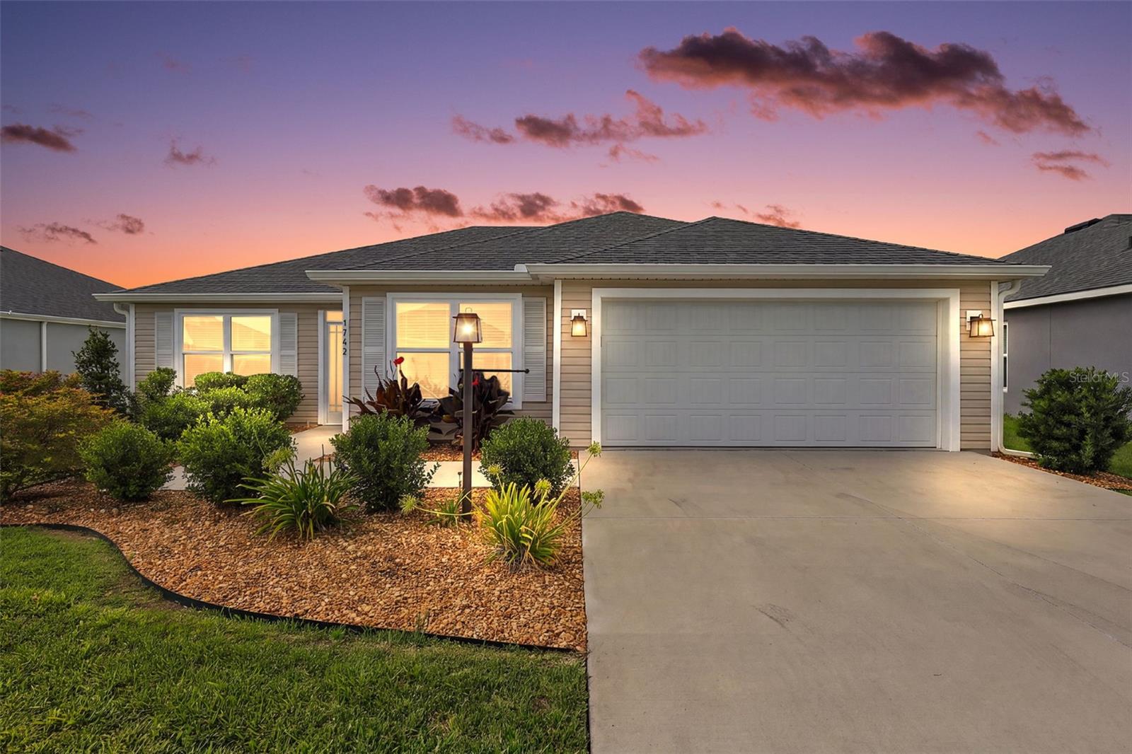 Virtually Staged. Welcome to this INCREDIBLE, 3/2 Wisteria (Jasmine) featuring a SPACIOUS SCREENED LANAI with EXTENDED PATIO and LARGE REAR YARD with ROOM FOR A POOL in the VIBRANT Village of Moultrie Creek! FANTASTIC LOCATION! - JUST MINUTES from the NEW Eastport Town Center! Built in 2024, this NEWLY CONSTRUCTED home offers LOW-MAINTENANCE peace of mind with CONTEMPORARY DESIGN! Adding to the exterior appeal of this INCREDIBLE home are LUSH landscaping with edging and STONED planting beds, SCREENED entry vestibule, SEAMLESS GUTTERS, and a side-lit front door. Step inside and discover an array of THOUGHTFUL UPGRADES, including ELEGANT CROWN MOLDING, DECORATIVE CORNICED WINDOWS, CUSTOM BLINDS, and UPDATED LIGHTING and CEILING FANS. Additionally, GORGEOUS LUXURY VINYL PLANK flooring flows seamlessly THROUGHOUT the main living areas, creating a stylish and cohesive look. The AMAZING kitchen boasts MODERN GREIGE SHAKER cabinetry, QUARTZ countertops, STAINLESS appliances with GAS range, built-in DOUBLE PANTRY with ROLL-OUT shelving, EAT-IN COUNTER-HEIGHT breakfast bar, and an adjacent DINETTE with EXTENDED CABINETRY and DOUBLE windows - perfect for casual dining. The OPEN-CONCEPT living and dining rooms are highlighted by HIGH VAULTED ceilings that create a SPACIOUS, EXPANSIVE area . From these rooms, FOUR-PANEL sliding glass doors open to a 20’x9’ SCREENED LANAI. This wonderful space is the perfect spot for ENTERTAINING friends and family or simply RELAXING with your morning coffee, evening cocktail, or a good book! There’s also an EXTENDED REAR PATIO for grilling and enjoying the beautiful Florida weather, while the SPACIOUS yard provides ample ROOM FOR A FUTURE POOL! Back inside, the primary bedroom features a VAULTED ceiling and GENEROUS CUSTOMIZED WALK-IN closet. Its en-suite bathroom offers GREIGE SHAKER cabinetry enhanced by ILLUMINATED toe-kick lighting, QUARTZ countertops, DUAL sinks, ROMAN-STYLE TILED WALK-IN shower, and a LINEN closet. A SPLIT FLOOR PLAN places two additional bedrooms and a second bathroom across the home, behind a POCKET door, ensuring plenty of PRIVACY for guests and/or a quiet home office. Both bedrooms feature LARGE windows and built-in closets, while a GREIGE SHAKER vanity with QUARTZ countertop, TILED tub and shower combination, and a hallway LINEN closet grace the second bathroom. A CENTRALLY-LOCATED, INTERIOR laundry room features a utility sink, shelving,  and a LARGE STORAGE closet. Completing the package is an EXTRA DEEP 20’x26’ TWO-CAR GARAGE with a whole-house Nova water softener and filtration system and PLENTY of room for parking and storage! DON’T MISS YOUR OPPORTUNITY to make this FANTASTIC HOME YOR OWN! The Village of Moultrie Creek is ideally located JUST MINUTES to Eastport Town Square and Middleton, where you’ll have easy access to shops, restaurants, and live nightly entertainment! Also close to Sawgrass Grove; Saluki and Olympia Recreation Centers; Shallow Creek Championship Golf Course; Shady Brook Pool; Farragut Softball Complex; Boosters Bar and Grill; Sophie Doodles Canine Park and much more! PLEASE WATCH OUR WALKTHROUGH VIDEO of this AMAZING HOME in a FABULOUS LOCATION and CALL TODAY to schedule your private showing or virtual tour!