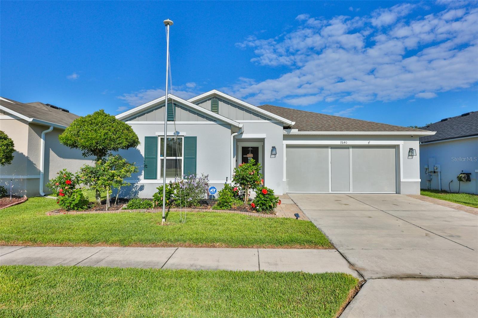 This is the home everyone looks for--the one with true PRIDE OF OWNERSHIP and character. That is THIS HOME- and it is located in one of the best areas of Lakeland! Built in 2019, this East facing, block-built home has been loved, meticulously maintained, and kept sparkling clean. Enjoy quick access to I-4 and US-98, putting shopping and dining right at your fingertips. Best of all, this small neighborhood features a low HOA ($178/Qtr) and no CDD fees! 

GREAT CURB APPEAL: Features lush green grass, a soaring flagpole, manicured flowerbeds, elegant coach lighting, a screened garage door, durable epoxy garage flooring, seamless gutters, security cameras with motion lighting, and extended driveway pavers. 

BACKYARD OASIS: The fully fenced yard features 6' vinyl fencing with lighted solar caps and TWO outdoor living spaces- a covered, screened lanai plus an extended paver screened patio for sun. Bonus: The John Deere riding mower is INCLUDED (see photos)! 

MODERN INTERIOR: Step inside this split 3-bedroom, 2-bathroom layout boasting a bright, open floorplan and a spacious great room with a vaulted ceiling. Newer updates include wood laminate flooring, a light filtering glass-framed front door, washer (2025), and a security system. The remodeled primary bathroom features a grout-less step-in shower with glass enclosure, granite bathroom countertop, upgraded mirrors and top-mount sinks. The modern kitchen is complete with custom cabinet pull-outs, brushed nickel knobs/pulls, undermounted lighting, microwave with exterior-vent, a Samsung 4-door French door refrigerator + Samsung oven (both under 1.5 years old)! 

UNBEATABLE LOCATION: Enjoy incredible proximity to everything your household needs! This home sits less than a mile from Hunt Fountain Park for outdoor sports and play, and under a mile from Clem Churchwell Elementary School for quick morning drop-offs. Within minutes you are at the massive US-98 shopping corridor featuring Sam's Club, Target, Aldi, and the Lakeland Square Mall with its Cinemark movie theater. Plus, you are just a short drive from the famous, award-winning 168-acre Bonnet Springs Park and approx 1 hour to DISNEY WORLD! Lakeland: the sweet spot between Tampa and Orlando!
 
HURRICANE-READY & NOT IN A FLOOD ZONE - Rest easy in this block-built home! Perfect home for VA, FHA or USDA buyers!