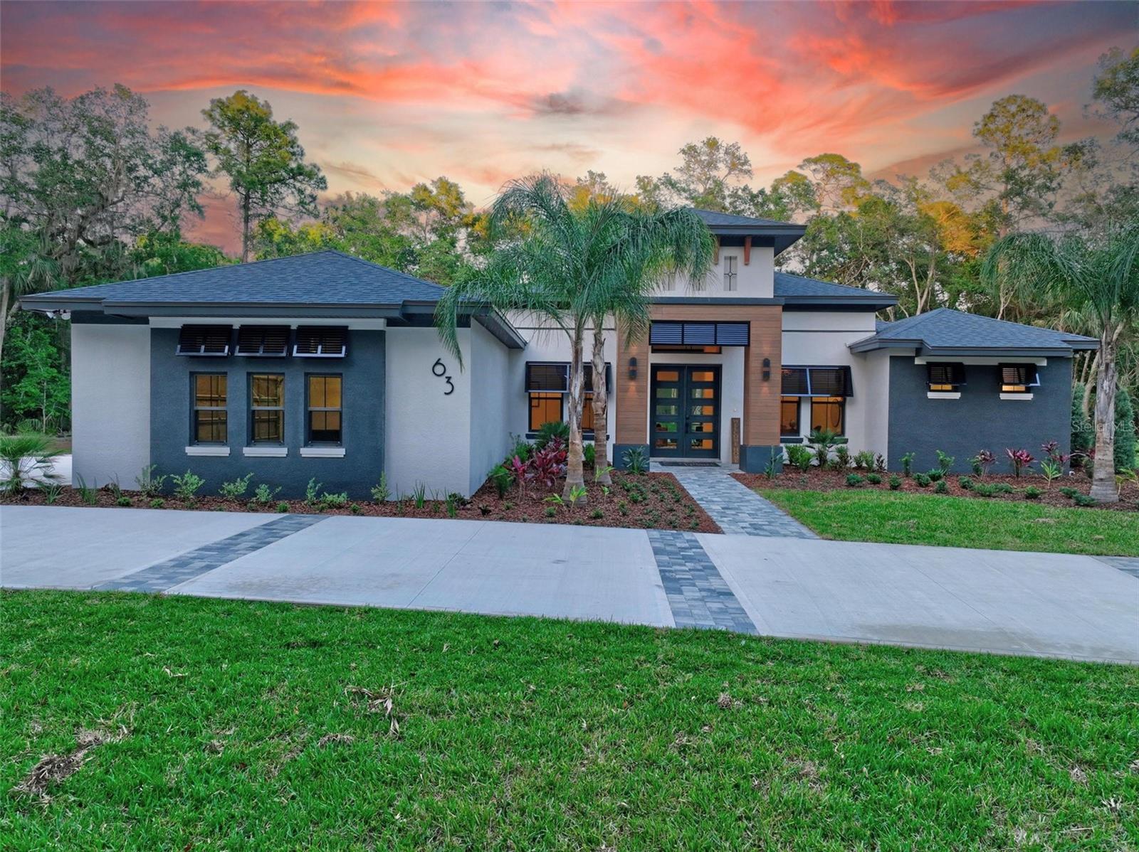 There are only 26 possible homes in this one-of-a-kind gated community. And each home has 5 acres. Enjoy the beautiful trees and the privacy created. Did I mention that this is the 2023 Parade of Homes Winner. We are featuring a 3135 sq ft 4 bed, 4 ba main house with 3 car garage, and a separate 440 sq ft full Casida with kitchen, bath, and 2 car garage. This home has state of the art electronics through-out, and a reverse osmosis water system for the purest drinking water you can have. High ceilings with open floor plan. All bedrooms are good size with available bathroom. This split floor plan has real style and drama, the kitchen featuring black cabinets, a duel fuel 7 burner range with 2 electric ovens, 172 bottle wine cooler for both red and white wine storage. All appliances are top of the line. Quartz countertops and backsplash with walk-in pantry, and a huge island with bar stools for extra seating. There is spectacular lighting throughout the house, with back-lit mirrors, under cabinet lighting, and dramatic fixtures. Relax in the salt water pool or dine outdoors under the screen room. There are so many upgraded features through-out the house you must come see for yourself. This property is close to everything, shopping, schools, the beach, the highway, golf courses, etc. This is the first and only resale within the development, normally you would have to wait 2 years after purchasing a lot. The last 2 lots in this development went for $420k and $600k, so this is why this house sold in 1 day when it first came out, unfortuantely the buyer was unable to complete the transaction.