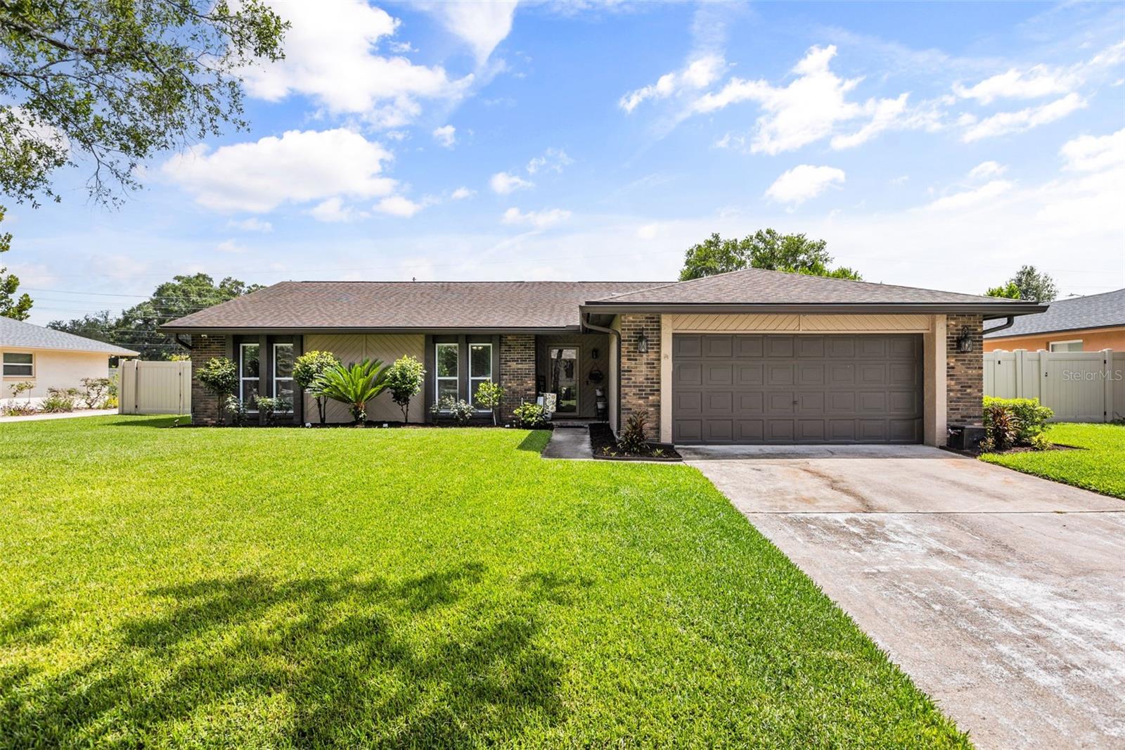 WELCOME HOME! This stunning 4-bedroom, 2-bathroom pool home is the perfect blend of style, comfort, and Florida living. Located in the highly sought-after school district for Winter Park High, Maitland Middle, and Lakemont Elementary, this home also offers unbeatable convenience with easy access to SR-417, University Boulevard, Aloma Avenue, SR-436, and countless shopping and dining destinations. You're less than five minutes from Publix, Target, and everyday conveniences. Step inside to beautiful luxury vinyl plank flooring and a completely renovated designer kitchen that is sure to impress. Featuring quartz countertops, a striking waterfall island, custom cabinetry with crown molding, a dedicated coffee bar, and abundant storage, this space is as functional as it is beautiful. The spacious family room offers plenty of room to relax and entertain, making it ideal for everything from cozy evenings at home to large gatherings with family and friends. The private primary suite features custom built-in closets that maximize storage, along with an updated en-suite bathroom complete with dual vanities and granite countertops. Three additional generously sized bedrooms provide flexibility for family, guests, or a home office.
Step outside and experience your own private Florida retreat. The beautifully paved covered patio offers the perfect place to unwind in the shade or entertain year-round. Beyond the patio is the show-stopping backyard, featuring a gorgeous solar-heated pool built in 2024 with a sun shelf, elegant decorative trim, and a tranquil waterfall feature. The meticulously maintained landscaping reflects the exceptional pride of ownership found throughout the property. As a resident of Woodside Village, you'll also enjoy access to outstanding community amenities, including a private boat ramp, community pool, tennis courts, and a nearby public playground. This move-in-ready home offers the perfect combination of modern updates, an incredible outdoor living space, and an unbeatable location. Don't miss your opportunity to make this Florida paradise your own! Roof was replaced in 2020, pool was built in 2024, water heater installed in 2025