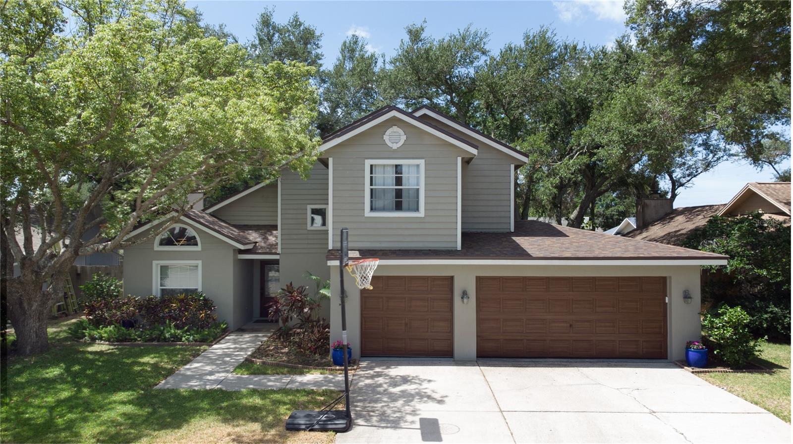 CREATE YOUR NEXT CHAPTER WITH THIS WONDERFUL 3bed/2.5bath family POOL home on a CUL-DE-SAC with a RARE 3-CAR GARAGE with a 2024 mini-split A/C & hand-painted doors in an A-RATED SCHOOL DISTRICT!  BRAND NEW ROOF MAY 2026, DISPOSAL 2026 (with UV light), WATER HEATER 2025,washer/dryer 2021, paint in/out 2020, A/C & PebbleTec SALT-WATER pool refinished & PAVERS 2018.  Features include vaulted ceiling in Living Room, Eat-in Kitchen & your fenced/screened backyard oasis with pool & spa.  Home has been lovingly-maintained & is chemical/pet/smoke-free.  Air handler/ducts/carpets recently cleaned (with 2 UV lights on air handler) & a Sentricon termite-eliminating system has been in place for 15 years.  RIDE YOUR BIKE to HONEYMOON ISLAND BEACH, Pinellas Trail or enjoy nearby, vibrant Downtown Dunedin & Palm Harbor with countless activities, festivals, dining & shopping options plus marinas & golf.  Home is NOT IN A FLOOD ZONE & had NO damage during 2024 hurricanes.  Tampa Airport is 32 minutes by car.  ENJOY LIVING CLOSE TO THE BEACH WITHOUT THE WORRY!