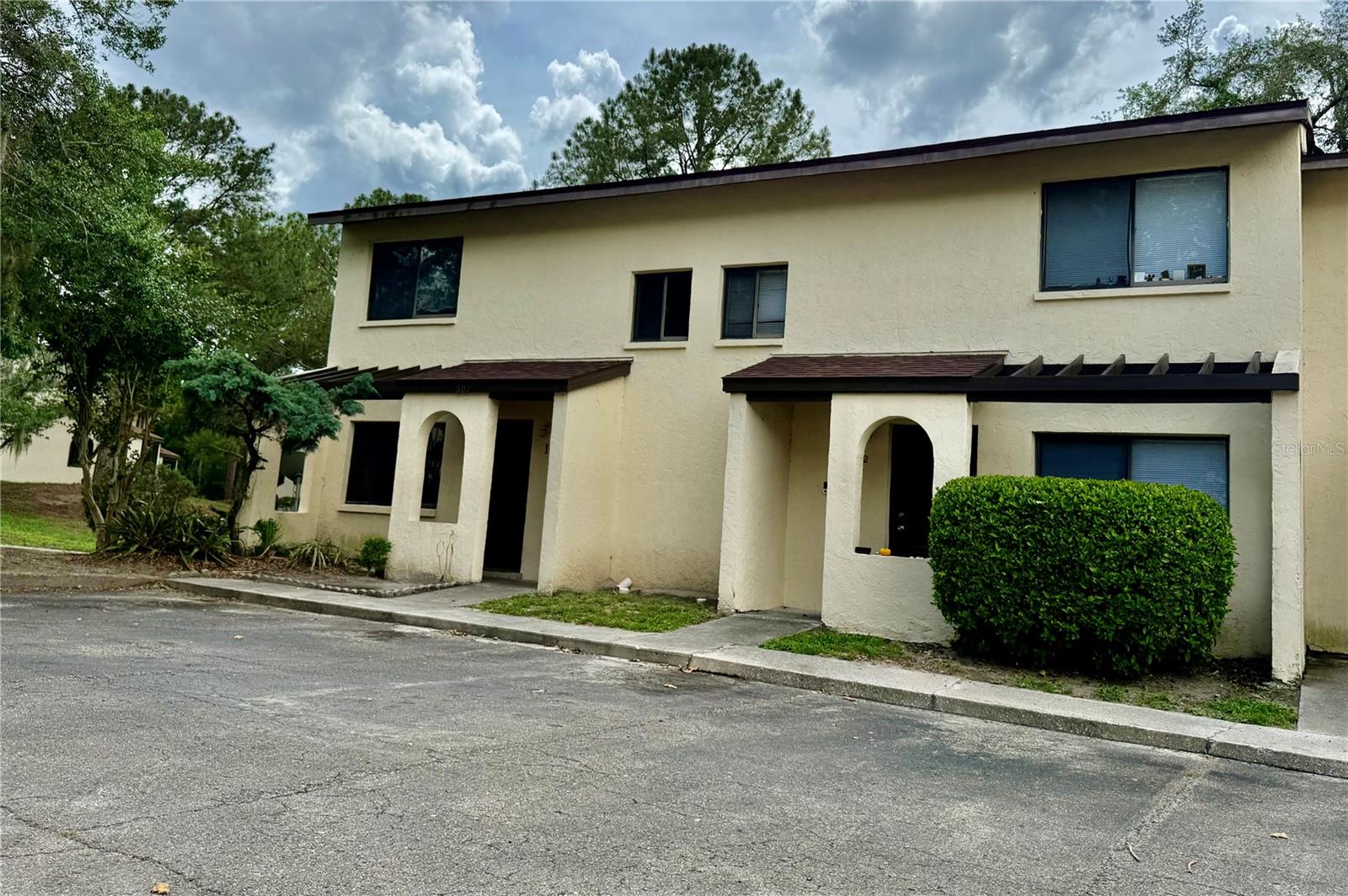 Location, Location! Located in the heart of SW Gainesville. This beautiful end unit 3 bedroom/2.5 bathroom Casablanca West townhome is located less than a mile away from UF, UF Health, the VA hospital and shopping! First floor features a large living room, dining area, open kitchen, one bedroom and one half bathroom. French doors in the living room lead to back yard that features a screened-in balcony for relaxing meals outside. There are two bedrooms upstairs equipped with new installed wood floor, each with its own full bathroom. Home has no carpet! Monthly association dues include water, trash services, and exterior insurance for the building, and the community pool. Great location close to shopping, restaurants and I-75. Also, Direct RTS bus route to UF. Don't miss out on this move in ready home!