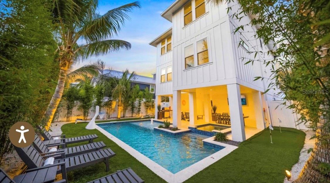 2206 Avenue A, Bradenton Beach, FL 34217
Luxury Investment Meets Coastal Perfection

A premier 7-bedroom, 7.5-bath luxury retreat just a 5-minute walk from Bradenton Beach. This 2022-built coastal haven combines elegant design, proven rental performance, and exceptional guest appeal—making it an ideal rental investment on coveted Anna Maria Island.

Designed for large groups and multi-family stays, this property offers an unbeatable combination of scale, amenities, and location—features that drive consistent high occupancy and premium nightly rates.

Investment Highlights:

Prime location — 5-minute walk to Bradenton Beach and close to Pine Avenue shops & dining

High-income layout — 7 bedrooms / 7.5 bathrooms (sleeps large groups comfortably)

Premium amenities — rooftop deck with panoramic Gulf & Bay views, private heated pool & spa, BBQ area, and outdoor lounge

Turnkey luxury — sold fully furnished and professionally designed with coastal chic interiors

Proven rental appeal — ideal for reunions, retreats, and vacation groups seeking a luxury experience

Strong ROI potential — similar homes on Anna Maria Island generate six-figure annual rental revenue

Inside, guests are greeted by an airy open-concept living space filled with natural light, a fully equipped chef’s kitchen with quartz counters and stainless appliances, and seamless indoor–outdoor flow through sliding glass doors. Every bedroom includes a private ensuite, ensuring comfort and privacy for guests.

From sunrise coffee on the balcony to sunset cocktails on the rooftop deck, Beachly Beloved offers an unforgettable guest experience—one that translates to repeat bookings and sustained income for savvy investors.

Your opportunity: A rare, income-producing coastal asset in one of Florida’s strongest luxury rental markets.