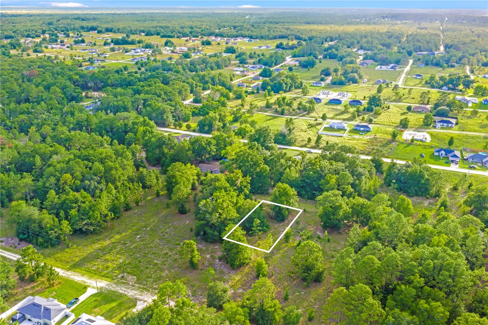 Nicely sized 75x135 homesite located in the desirable Rainbow Park subdivision of Ocala! Zoned R-1, this property offers an excellent opportunity to build your dream single-family home with plenty of room for outdoor living, entertaining, and enjoying Florida’s beautiful weather. Situated in a peaceful rural setting, yet conveniently located approximately 10 miles from the World Equestrian Center, where you can enjoy world-class equestrian events, dining, shopping, and entertainment. Don’t miss this opportunity to own a spacious homesite in a growing area while enjoying the charm, tranquility, and convenience of Ocala living.