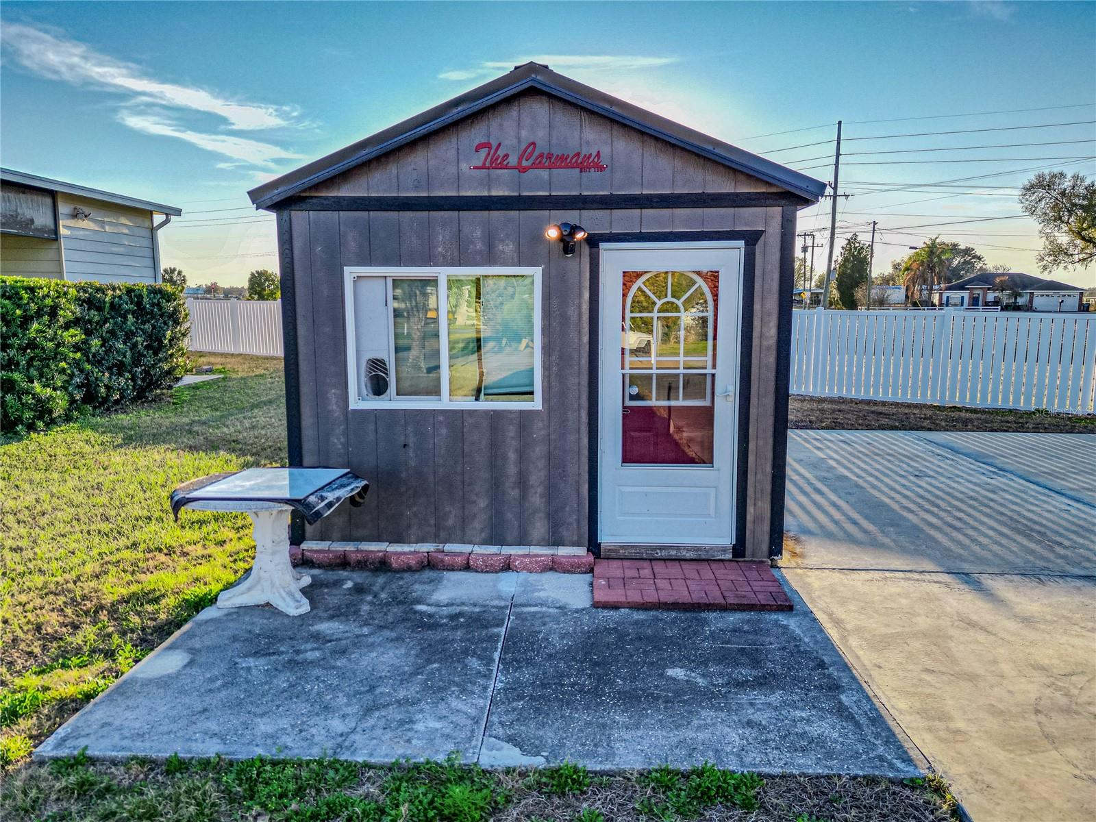 Welcome to 4905 Shore Line Drive in the highly sought-after Mount Olive Shores community — an exclusive, gated neighborhood designed specifically for Class A motorhome living. Located in Phase 2 and conveniently positioned near the back entrance/exit, this property offers both privacy and easy access in and out of the community.

This oversized 63’ x 124’ lot provides exceptional space — larger than many in the neighborhood — giving you flexibility, comfort, and room to enjoy your outdoor surroundings. The expansive concrete pad is designed to easily accommodate your Class A motorhome and is already equipped with full public utility hookups and 200 AMP electrical service for seamless setup.

The finished, air-conditioned and heated casita shed is a standout feature. Thoughtfully designed for comfort and convenience, it includes a full bathroom, washer and dryer, refrigerator, microwave, and a welcoming living area — perfect for entertaining guests, relaxing after a day of travel, or expanding your functional living space beyond your coach.

The HOA offers tremendous value, covering trash service, basic lawn care, maintenance of common areas, and access to the gated entrances and community amenities. Mount Olive Shores is a deed-restricted community exclusively for Class A motorhomes, preserving the integrity and lifestyle owners expect. Residency requires ownership or lease of a Class A motorhome during your first year of accumulated residency.

Conveniently located just minutes from I-4, you’ll have quick access to Tampa and Orlando, major airports, shopping, dining, medical facilities, and Central Florida attractions — all typically within an hour.

If you’re looking for a spacious, well-equipped lot in a premier motorcoach community with easy access and exceptional convenience, this property is ready to welcome you. Schedule your private showing today.