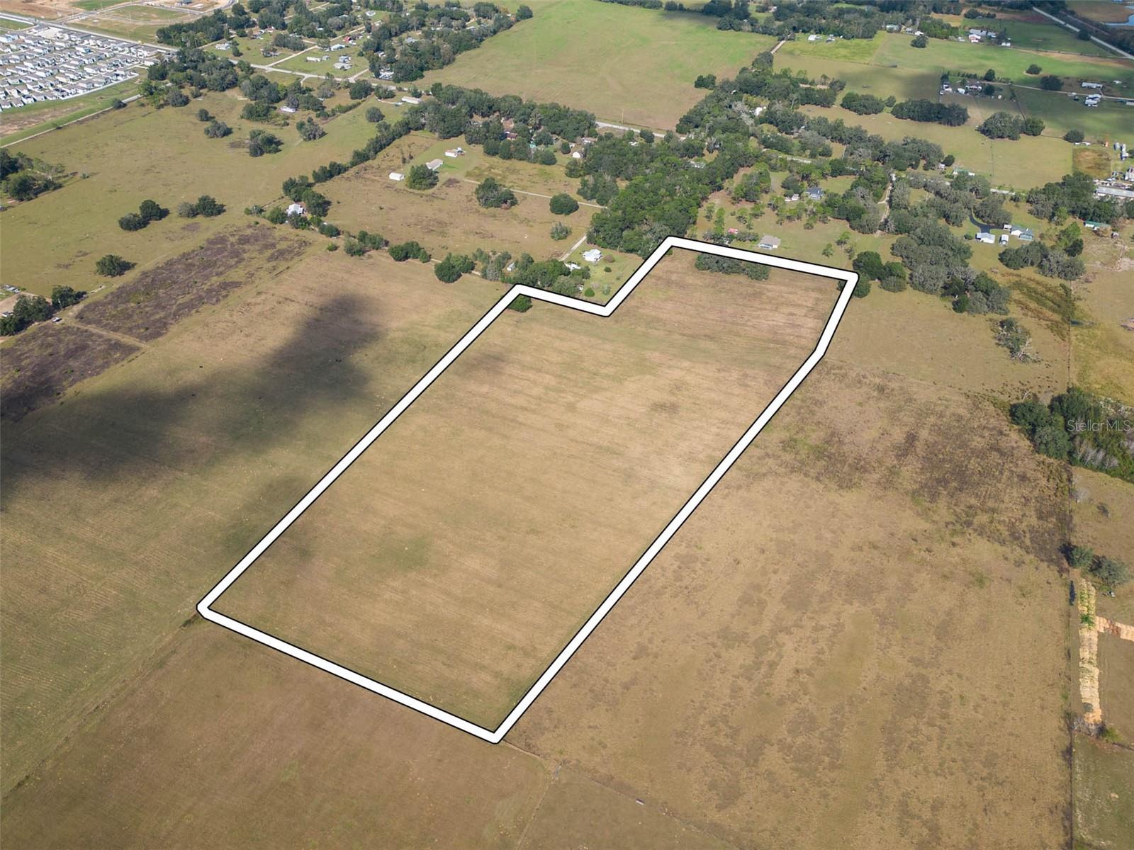 Tremendous opportunity to acquire a 26.06 land tract with great potential for future development and 1031 exchange investment. Sale consists of 2 parcels (Pasco parcel#'s 12-25-21-0000-00800-0000 and 12-25-21-0000-00900-0030) totaling 26.06 acres situated on the path of the proposed US98 reroute into Dade City. Proposed US98 project would create approximately 1,000 feet of road frontage along the new US98 route. Parcels have been annexed in to the Dade City limits. The Dade City planning department has conditionally approved the rezoning of the parcels for a planned unit development. A planned unit development plan has been submitted to Dade City planning with approval pending based on conditions. Conditional approval uses include single family residential and multi family with a maximum of 4 residential units per acre and lot widths ranging from 40' to 60'. City water and sewer utilities are nearby at other recently completed residential developments. Located 1.3 miles to newer shopping plaza that includes big box grocery store, restaurants, and banking. Only 5.2 miles to Lowe's, WalMart Supercenter and less than 30 minute drive to larger shopping malls.