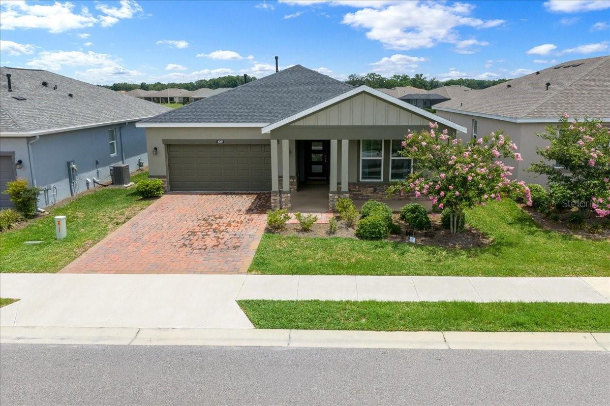 Welcome to this beautifully appointed Declare model by Shea builders, a 2-bedroom, 2.5-bath home with a versatile bonus room, ideally situated in the highly sought-after community of Ocala Preserve. The bonus room has been enhanced with elegant French doors, providing the perfect private space for a home office, den, hobby room, or guest overflow area. Perfectly positioned on a premier lot, this home offers open views, no direct rear neighbors, and direct access to one of the community’s scenic walking paths, creating the ideal combination of privacy, convenience, and Florida lifestyle living. With over $70,000 in upgrades, including a whole-house water filtration system, this home showcases quality, style, and thoughtful design throughout. Designed with both comfort and entertaining in mind, the open-concept floor plan features upgraded tile flooring throughout and a bright, modern aesthetic. The chef-inspired kitchen is the heart of the home, boasting quartz countertops and a matching backsplash, stainless steel appliances, under-cabinet lighting, and convenient pull-out drawers for pots and pans. The oversized island provides ample prep space and seating, making it the perfect gathering place for family and friends. The spacious primary suite offers a private retreat with a luxurious ensuite bath featuring dual vanities, a frameless glass walk-in shower, and a large walk-in closet complete with custom built-in shelving and cabinetry. An oversized sliding glass door fills the living area with natural light and opens seamlessly to the screened lanai, where you can relax and enjoy the peaceful surroundings. Beautiful landscaping further enhances the home’s curb appeal and outdoor living experience. 
Enjoy resort-style living in Ocala Preserve, where exceptional amenities, golf, walking trails, fitness facilities, dining, pools, and an active social lifestyle are all just moments from your front door. This is Florida living at its finest.