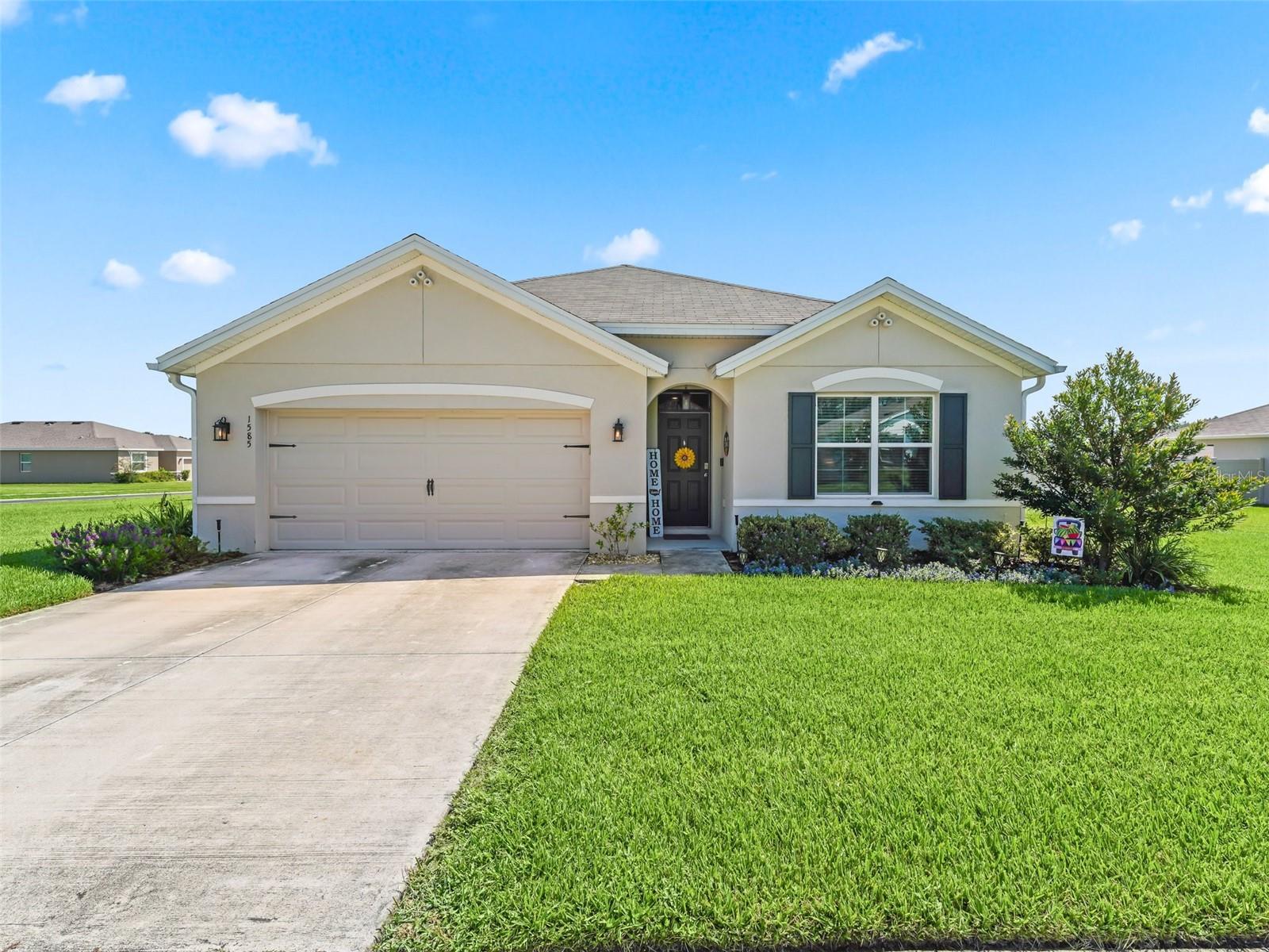 Welcome to your 4/2 home with a 2-car garage on this well-maintained property.  The one-story layout provides great living space with an open floor plan.  There is a breakfast bar in the kitchen, as well as, a dining room that serves for sit-down meals.  The sliding doors off the dining area are to the enclosed lanai where you can enjoy reading, working, or sipping your favorite beverage while relaxing in the privacy of your fenced-in backyard.  The backyard is large enough to build a pool as well.  The primary bedroom is located at the back of the home and has an ensuite bathroom. There are three additional bedrooms with a second bathroom.  The bedrooms have carpet and the living areas have vinyl flooring.  The laundry room is indoors with shelving for storage.  Make an appointment to see this home today!
