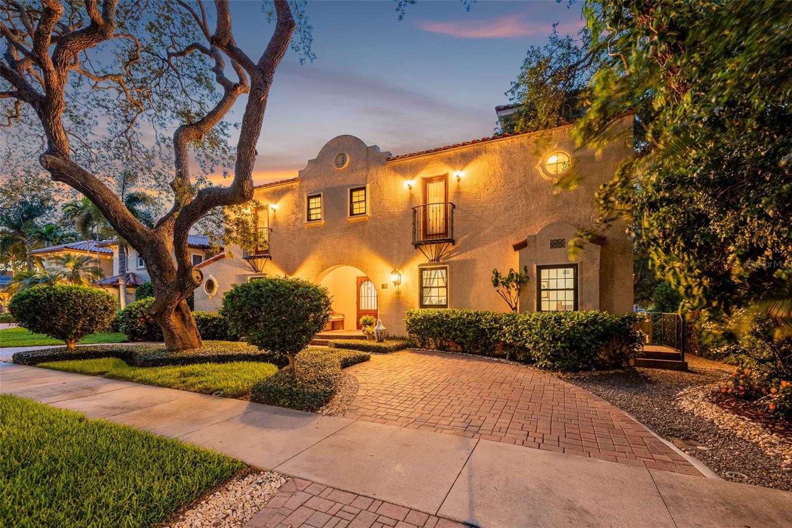 Nestled on just over a quarter acre in the heart of Belleair, this exceptional residence is recognized as one of the Town's historic homes, blending timeless architectural character with modern comforts in one of the area's most sought after locations. Located in an X flood zone, with no history of flooding and flood insurance not required, this remarkable property is ideally positioned near the prestigious Pelican Golf Club and Belleair Country Club, world famous Gulf beaches, boutique shopping, charming neighborhood cafes, and a world renowned hospital, offering an unmatched combination of elegance, convenience, and lifestyle.

Surrounded by lush, mature landscaping, the property offers a private resort style setting highlighted by a sparkling pool, expansive outdoor living areas, and an enclosed patio overlooking the backyard oasis. Designed for both relaxation and entertaining, the outdoor spaces create a true retreat like atmosphere.

Inside, distinctive architectural details set this home apart, including elegant rounded archways, rich hardwood flooring, and thoughtfully designed living spaces that blend historic character with modern functionality. The open concept kitchen features a gas Wolf range, quality cabinetry, generous workspace, and seamless flow into the main living and dining areas.

The flexible floor plan includes three spacious ensuite bedrooms on the upper level, including a well appointed primary suite featuring an exceptionally large custom built walk in closet and an adjoining room ideal for a private study, nursery, fitness space, or wellness room. A room currently utilized as an executive study on the main level can easily be transformed into a fourth bedroom, providing additional flexibility for family, guests, or multigenerational living.

Enhancing both comfort and functionality are a whole home generator, integrated dehumidification system, custom wine cellar, oversized three car garage, and abundant storage. The home's exceptional condition reflects years of attentive ownership and care.

Combining historic charm with thoughtful modern updates, this remarkable residence is designed for both everyday living and effortless entertaining. From the resort style backyard to the spacious living areas and sought after Belleair location, every aspect of the home reflects quality, character, and enduring appeal.