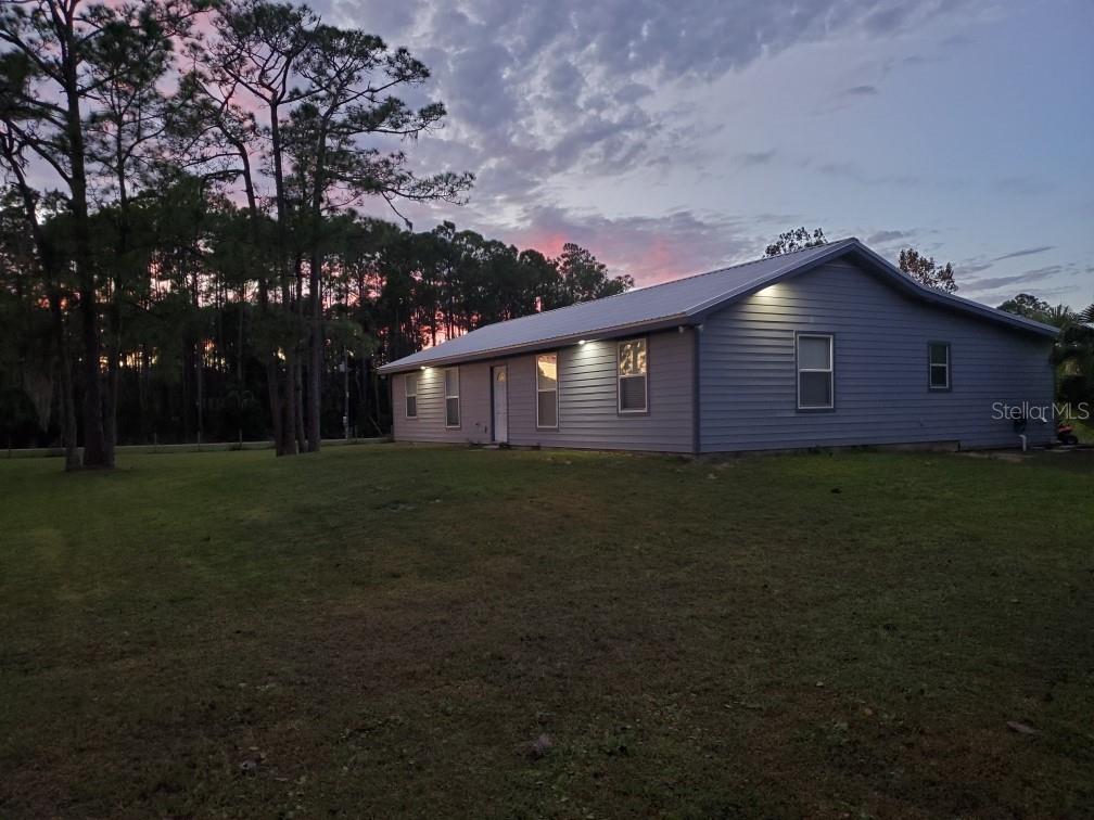 MAJOR REDUCTION!!!!!!!!! EXCELLENT LOCATION!!  Bikers, Race Fans, Campers-This is your ticket to live your dream! 4 bedroom, 2 full bath home with a 12 foot tall 60X40 foot Pole Barn for bike parking, camping and storage. This 2+ Acre property is only 1.6 miles from the New Smyrna Speedway, .6 miles from the famous Cabbage Patch-Daytona's oldest biker bar and 15 minutes from Daytona International Speedway. The metal roof was installed in 2019 as well as James Hardy siding and soffits. The property is completely fenced with 2 working gates for privacy. There is also a pond and private well. The pole barn could easily be enclosed making for a great work shop or barn. This beautiful natural setting  offers peaceful country living  with quick easy access to beaches, restaurants, the flea market and Daytona attractions. BRING OFFERS, MOTIVATED SELLER!!!!!!!!!!!!!!!!!!