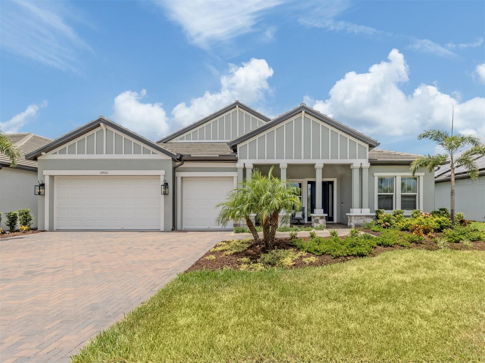 Experience luxury, space, and exceptional design in this stunning lakefront pool home located within the gated Oasis community of Wellen Park. Built in 2023, this impressive Interlude model offers over 3,000 square feet of thoughtfully designed living space with 4 bedrooms, 3.5 baths, a versatile flex room ideal for a home office, media room, or playroom, and an oversized 3-car garage featuring a durable epoxy-coated floor.
Designed for both everyday living and effortless entertaining, the open-concept floor plan showcases soaring ceilings, hurricane-impact windows, recessed lighting, custom cabinetry, quartz countertops, brushed gold fixtures, and a premium Sonos whole-home sound system conveniently controlled from your phone. The spacious great room is highlighted by a stunning custom feature wall featuring a sleek electric fireplace, illuminated display shelving, and elegant stone backsplashes that create a dramatic designer focal point that adds warmth and sophistication.
The chef's kitchen is the heart of the home, offering stainless steel appliances, abundant quartz counter space, a large center island with breakfast seating, and generous storage. Expansive sliding glass doors open to the covered lanai where you'll enjoy your private pool overlooking tranquil lake views and breathtaking western sunsets.
The luxurious primary suite is a private retreat featuring a large walk-in closet and spa-inspired bath with dual quartz vanities, a freestanding soaking tub, and an oversized walk-in shower with dual shower heads. A desirable split-bedroom design provides privacy for family and guests with three additional bedrooms, a Jack-and-Jill bath, and a third full bath that also serves as a convenient pool bath.
Beautifully landscaped and meticulously maintained, this home also offers a welcoming front porch perfect for evening visits with the neighbors. Residents of Oasis enjoy resort-style amenities including a clubhouse, pool, pickleball courts, walking trails, and a dog park. Ideally located in the heart of Wellen Park, you'll be just minutes from Downtown Wellen, CoolToday Park, shopping, dining, golf, beautiful Gulf beaches, and all that the Venice area has to offer.
This exceptional home offers the perfect combination of luxury, comfort, and the Florida lifestyle you've been dreaming of.