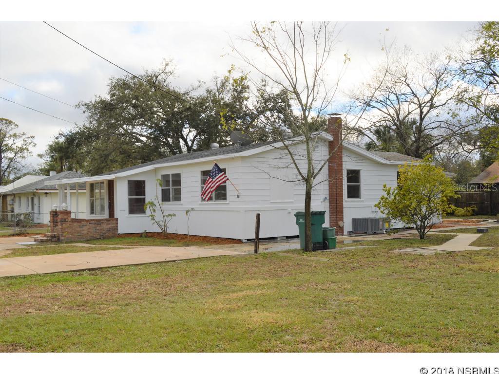 Hard to find 4+ bedroom home in the heart of Holly Hill and ready for immediate occupancy. This home has been brought to life with New interior and exterior paint, New appliances, New flooring, New electrical panel and New HVAC system. All of the expensive items are taken care of and this home is move-in ready. There is also a bonus room that could be used for additional bedroom or office space. Lots of windows for light and completely fenced for pets and children. Master bdr has a seperate sitting area or perfect for couple with baby or small child. This home is also designed for extended family.  Additional separate detached workshop/storage/multipurpose bldg. Also has large gated front yard area to park up to 4 cars.  Additional lot next door is owned by the County of Volusia and is for sale for approx. $10K. See info in docs. Priced to sell. Come see... ;Water: City