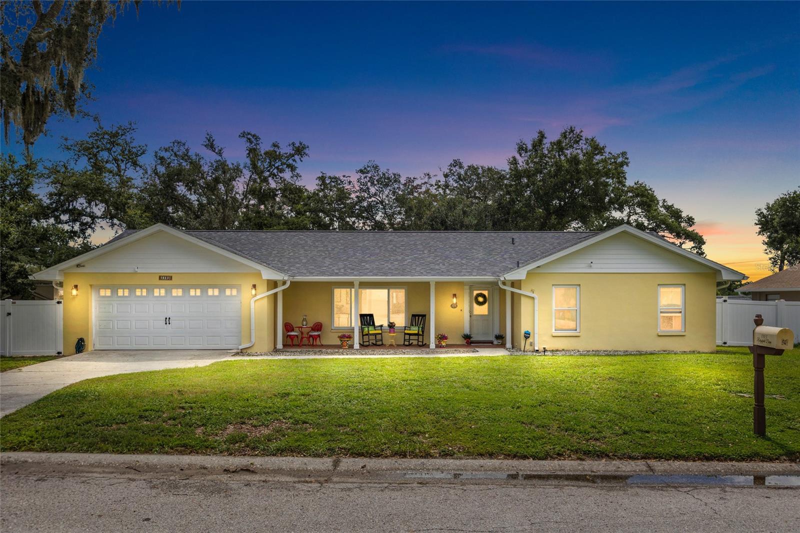 Tucked away on a quiet cul-de-sac in the heart of Valrico, this beautifully updated 3-bedroom, 2-bath home offers the perfect blend of elegance, comfort, and resort-style outdoor living. Situated on an oversized, fully fenced lot of more than a quarter acre, this exceptional property has been meticulously maintained and thoughtfully upgraded, making it truly move-in ready. From the moment you step inside, you'll appreciate the seamless wood-look tile flooring that flows throughout the home, creating a warm, sophisticated feel. The spacious family room is anchored by a stunning wood-burning fireplace with a classic brick surround, while the expansive dining room is surrounded by windows that frame picturesque views of the backyard oasis, filling the home with natural light. The heart of the home is the beautifully remodeled kitchen, designed for both everyday living and entertaining. It features granite countertops, an eye-catching tile backsplash, abundant cabinetry, accent lighting, a closet pantry, and a charming breakfast nook. Just beyond the kitchen is a versatile bonus room with two closets—ideal as a private home office, hobby space, playroom, fitness space or even a potential fourth bedroom. The private owner's suite offers a spacious walk-in closet and a beautifully remodeled en-suite bath designed with comfort in mind. The guest bathroom has also been tastefully renovated. Even the laundry room has been enhanced with a newer Maytag washer and dryer, built-in shelving, and is currently utilized as an oversized walk-in pantry for exceptional storage. Step outside and experience your own private resort. The newer saltwater pool and separate five-person hot tub are surrounded by an expansive paver patio, all enclosed within a screened lanai featuring an enormous covered entertaining area. Whether you're hosting weekend gatherings, enjoying family barbecues, or relaxing after a long day, this outdoor living space is designed to be enjoyed year-round. The oversized backyard also includes a large storage shed and plenty of room for pets, play, or gardening.
Buy with confidence knowing the major updates have already been completed:
* New roof (2023)
* Hurricane-impact windows (2025)
* New HVAC system (2026)
* Two-car garage
* Oversized cul-de-sac lot of over ¼ acre. 
Located just minutes from shopping, restaurants, parks, and top-rated schools, this home offers the perfect combination of luxury, functionality, and location. Homes with this level of care, upgrades, and outdoor living rarely become available. Schedule your private showing today and discover why this exceptional Valrico home stands out from the rest.