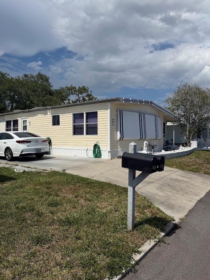 Investor pricing on this Post 1976 Mobile home Located in the desirable resident-owned Venice Isle 55+ community, this 2-bedroom, 2-bath manufactured home offers 1,320 sq. ft. of living space plus a lanai on a 4,692 sq. ft. lot in Flood Zone X. The home features a 2025 water heater, public water and sewer, and an original interior ready for your personal updates. Roof damage is present, and the carport was lost during a hurricane; however, the seller reports no leaks or water intrusion. A great opportunity to renovate and make it your own while enjoying all that Venice Isle has to offer.  55+ resident-owned cooperative (Venice Isle Estates). Buyer must purchase in natural person’s name — no LLC or entity ownership. Buyer must be 55+). Board approval required prior to closing.